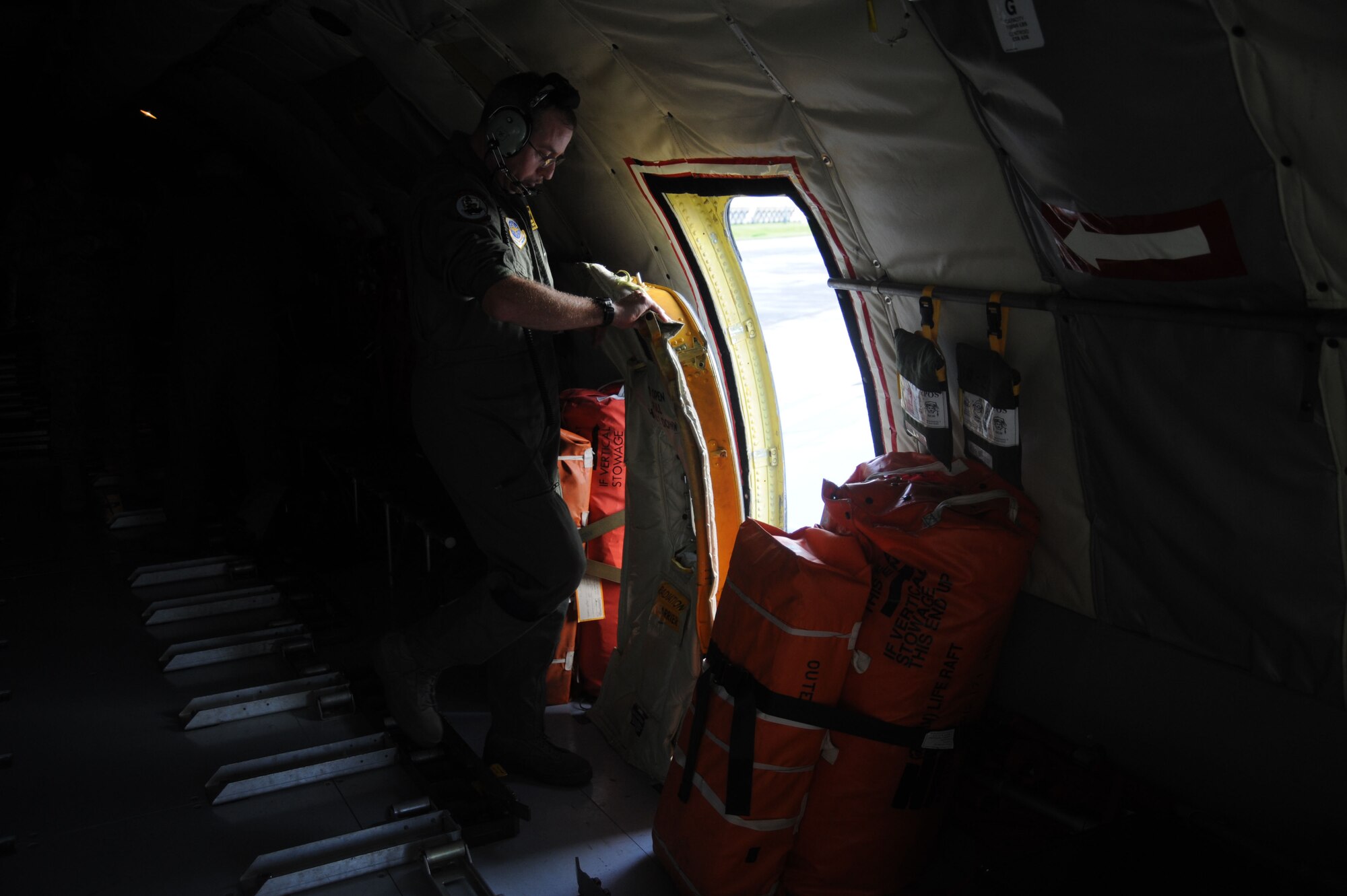 Master Sgt. Pat Sharkey latches a KC-135 Stratotanker door prior to a B-52 Stratofortress refueling mission originating from Andersen Air Force Base, Guam on Nov. 13, 2008. Master Sgt. Sharkey is a boom operator assigned to the 171st Air Refueling Wing Pennsylvania Air National Guard deployed to Andersen A.F.B. in support of Pacific theater refueling operations.(U.S. Air Force photo by: Master Sgt. Kevin J. Gruenwald) released   
