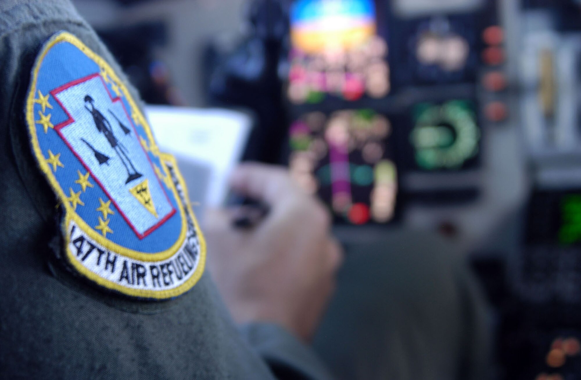 Lt. Col. David Kortyna,  171st Air Refueling Wing KC-135 pilot, manages flight documents while on a refueling sortie over the Pacific Ocean, Nov. 13, 2008   Colonel Kortyna is deployed from the Pennsylvania Air National Guard to support  Andersen Air Force Bases Global Deterrence mission. (U.S. Air Force photo by: Airman 1st Class Ryan Whitney)                               