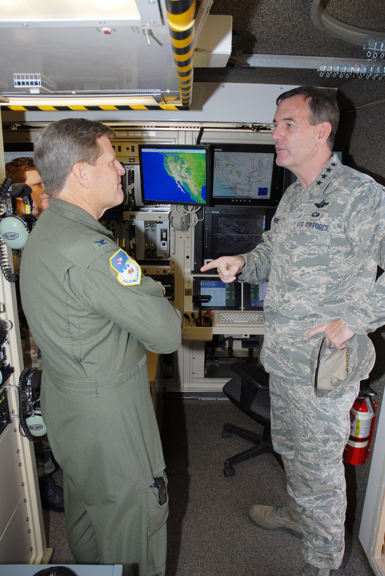 AETC Commander Gen. Stephen Lorenz chats with Col. Randall Ball, 163 OG commander, during his visit to the 163d Reconnaissance Field Training Detachment.
General Lorenz was escorted by Commander of the California Air National Guard,
Maj. Gen. Dennis Lucas, and 163 RW Commander Col. Albert Aimar. During the visit, General Lorenz spoke about the present and future of the Unmanned Aerial Vehicle mission. (U.S. Air Force photo by SrA Paul Duquette)