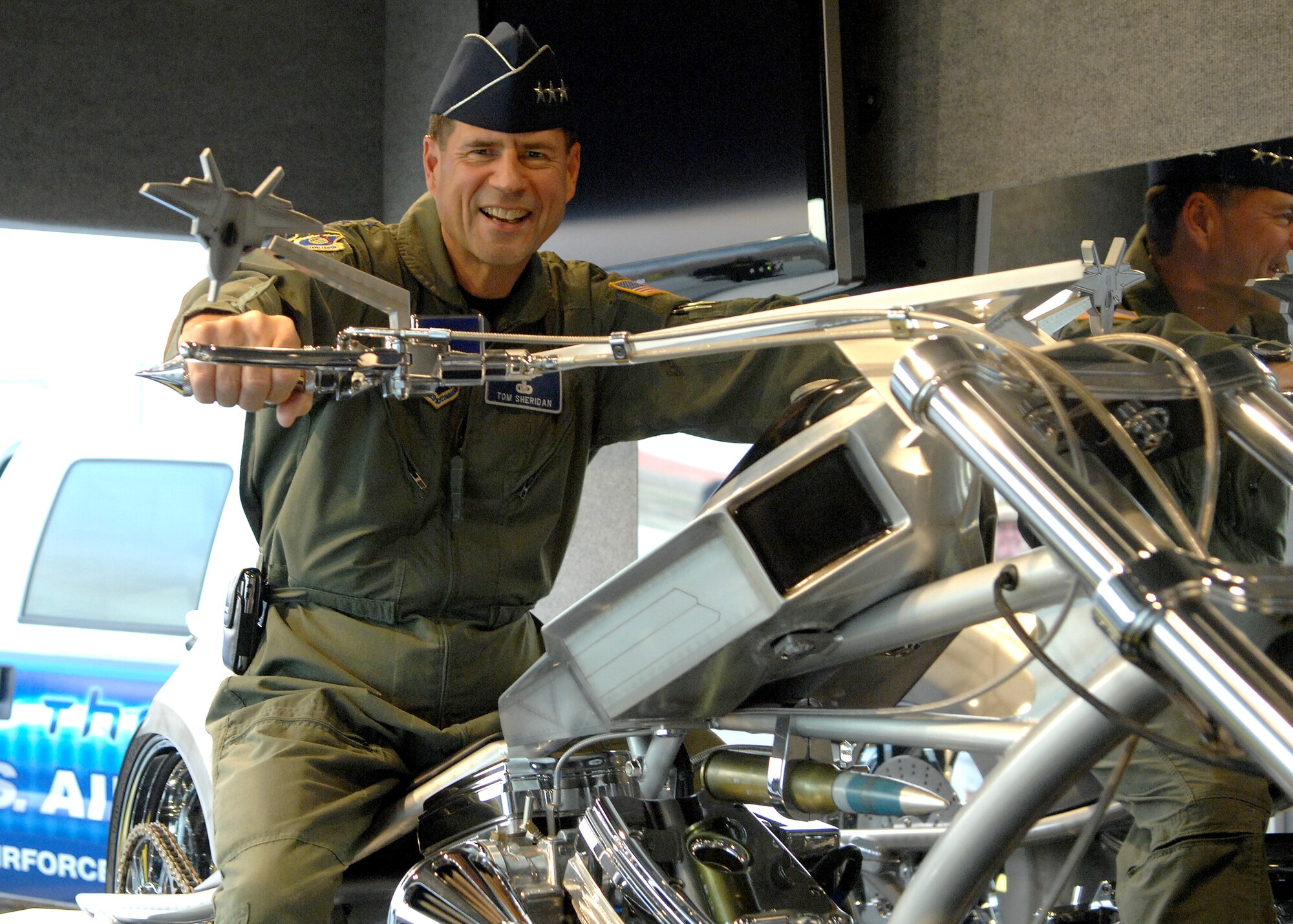 U.S. Air Force Lieutenant General John T. Sheridan, Commander, Space and Missile Systems Center, Air Force Space Command, Los Angels Air Force Base, California, sits on the Air Force Orange County Chopper during Wings Over Long Beach at the Long Beach Airport, November 15, 2008.  (U.S. Air Force photo by Senior Airman Matthew Smith)