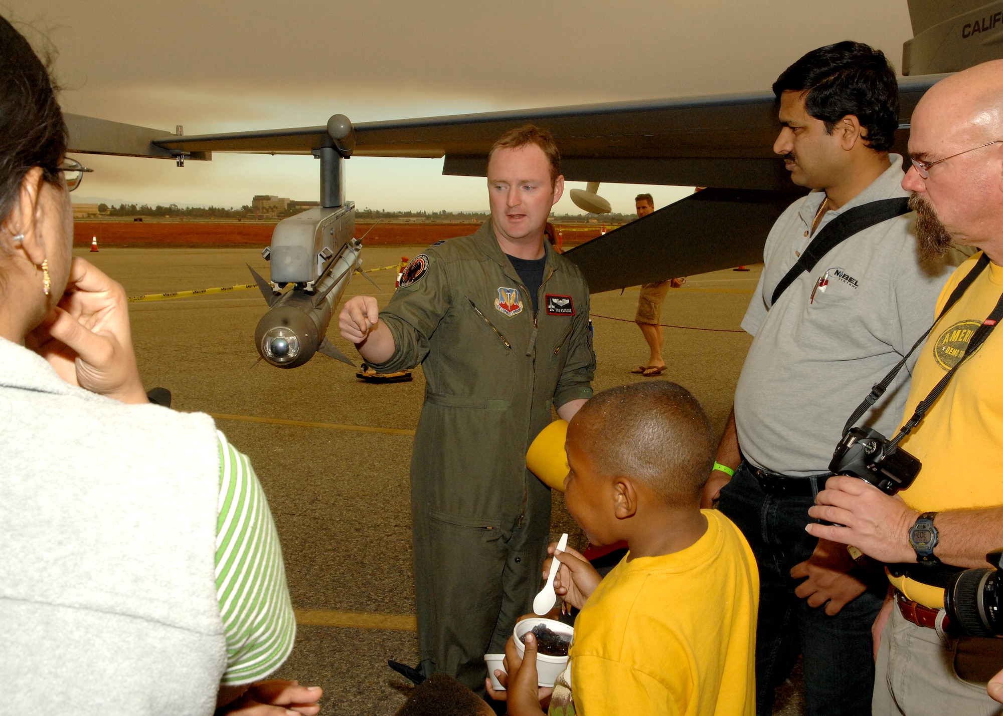 U.S. Air Force Captain Dan Woodside, a pilot with the 194th Fighter Squadron, Fresno Air National Guard Base California talks to visitors about the F16C during Wings Over Long Beach at the Long Beach Airport, November 15, 2008.  (U.S. Air Force photo by Senior Airman Matthew Smith)