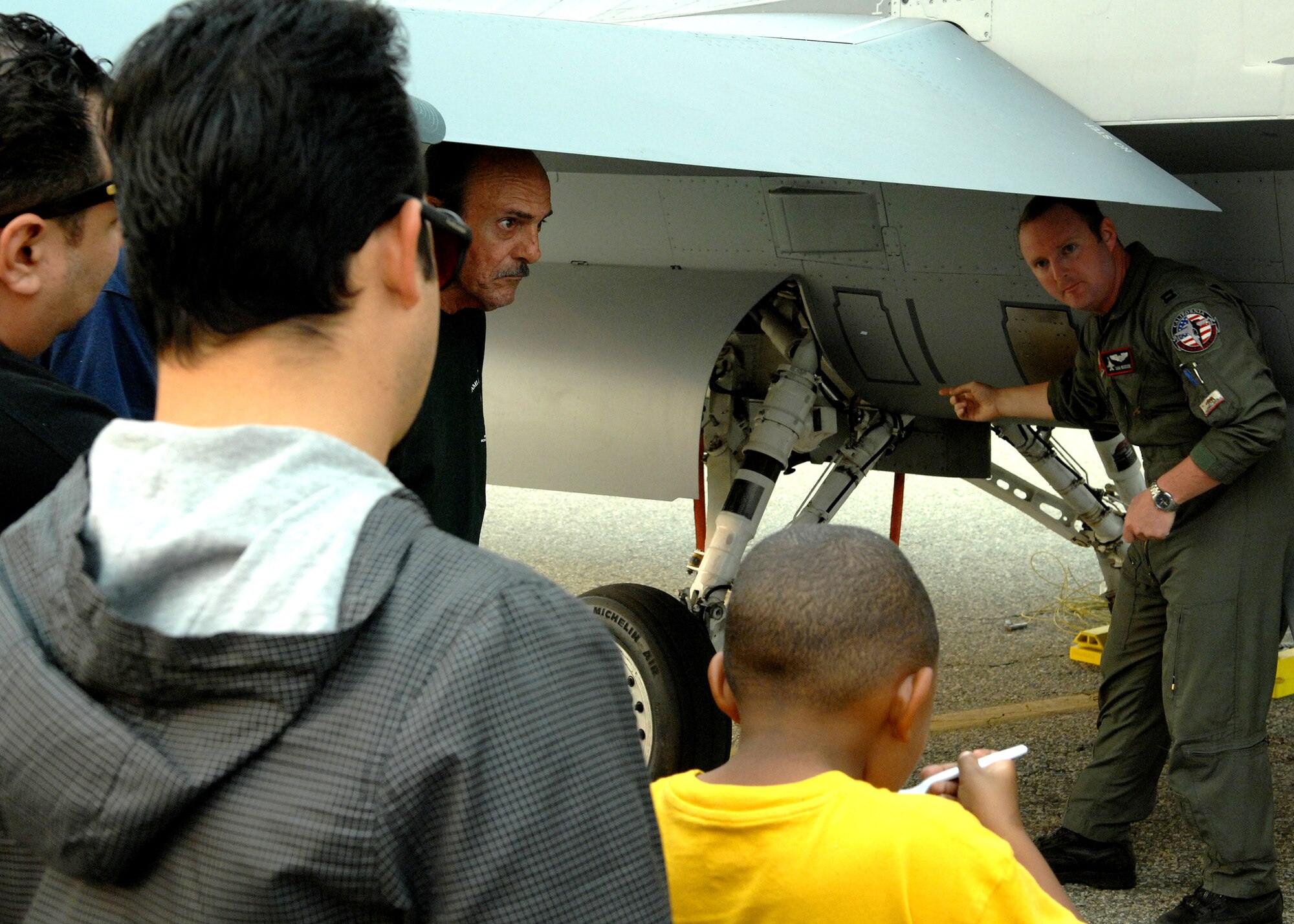 U.S. Air Force Captain Dan Woodside, a pilot with the 194th Fighter Squadron, Fresno Air National Guard Base California talks to visitors about the F16C during Wings Over Long Beach at the Long Beach Airport, November 15, 2008.  (U.S. Air Force photo by Senior Airman Matthew Smith)