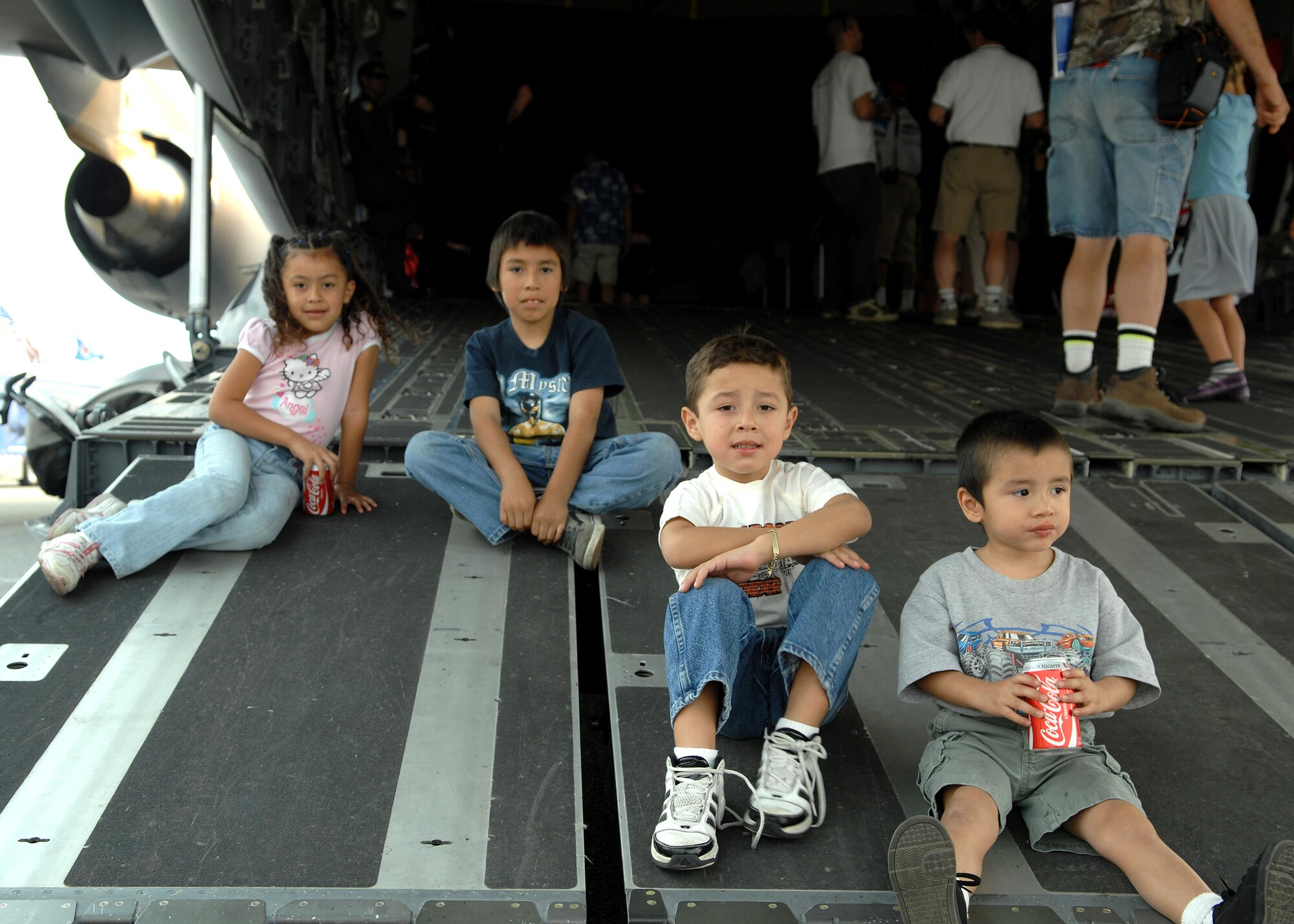 The Pineda Children from Baldwin Park California sit on the tail ramp of a C17 Globemaster III during Wings Over Long Beach at the Long Beach Airport, November 15, 2008.  (U.S. Air Force photo by Senior Airman Matthew Smith)