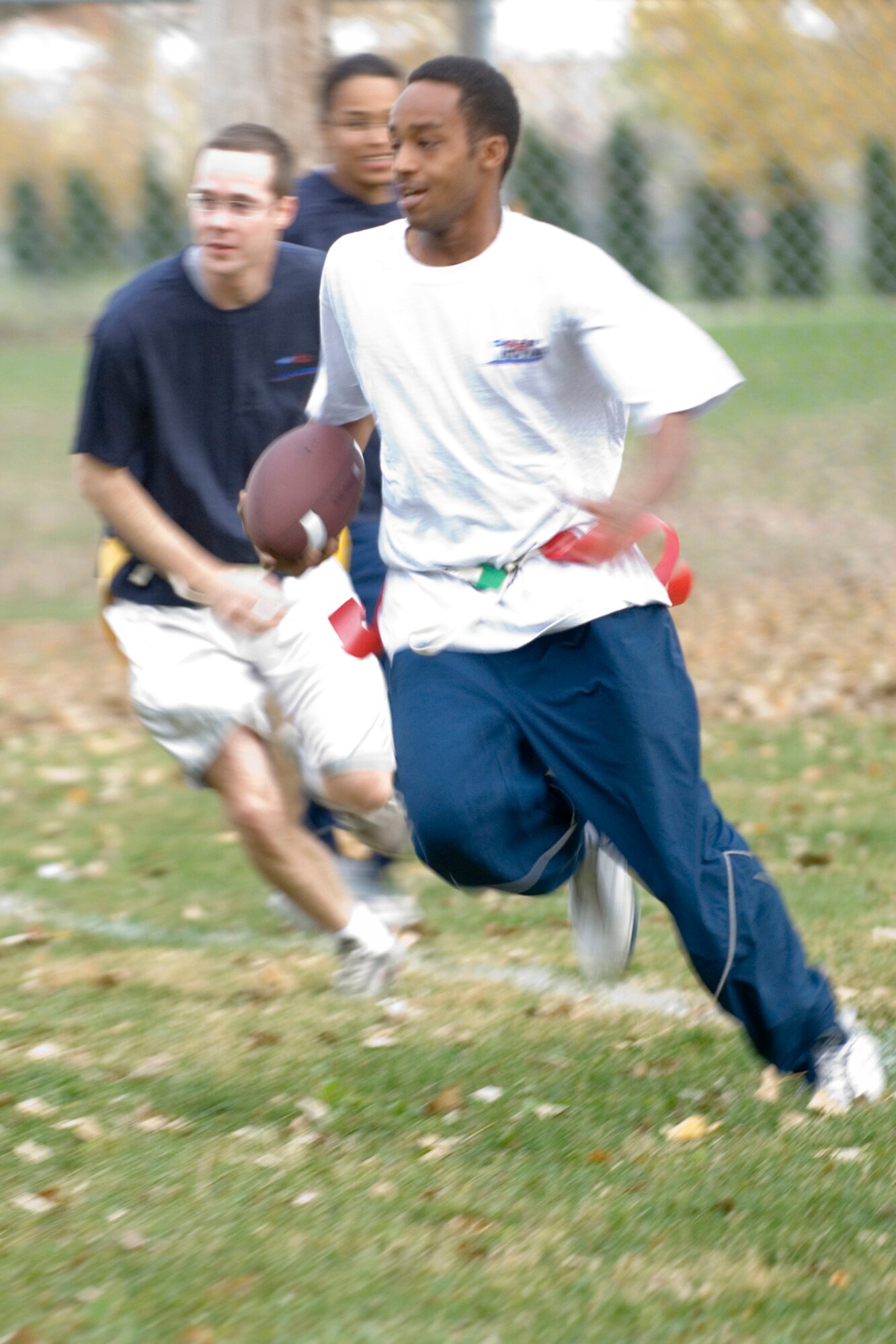 GRISSOM AIR RESERVE BASE, Ind., -- Lance Pryor, a jet engine mechanic with the 434th Maintenance Squadron, knife's his way toward the goal eluding pursuers during a game of flag football recently. The players were made up mostly of seasoning training program members. They participate in organized physical training on Tuesdays and Thursdays. (U.S. Air Force photo/Tech. Sgt. Doug Hays)