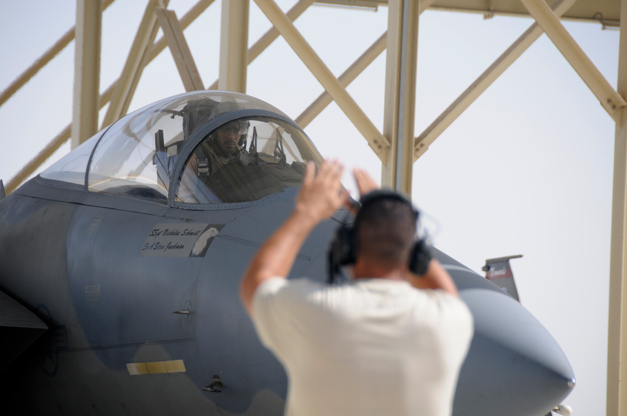 SOUTHWEST ASIA -- Capt. Rick Jones, pilot, looks to Staff Sgt. Mike Membrilla for directions to safely maneuver his F-15 onto the runway here Nov. 13. Captain Jones and Sergeant Membrilla are members of the 58th Fighter Squadron, Eglin Air Force Base, Fla. They are deployed here in support of a multi-national exercise. The exercise is held to provide coalition training with various airframes, improving interoperability while honing skills. The exercise is held throughout November. (U.S. Air Force
photo/Tech. Sgt. Christopher A. Campbell)(released)
