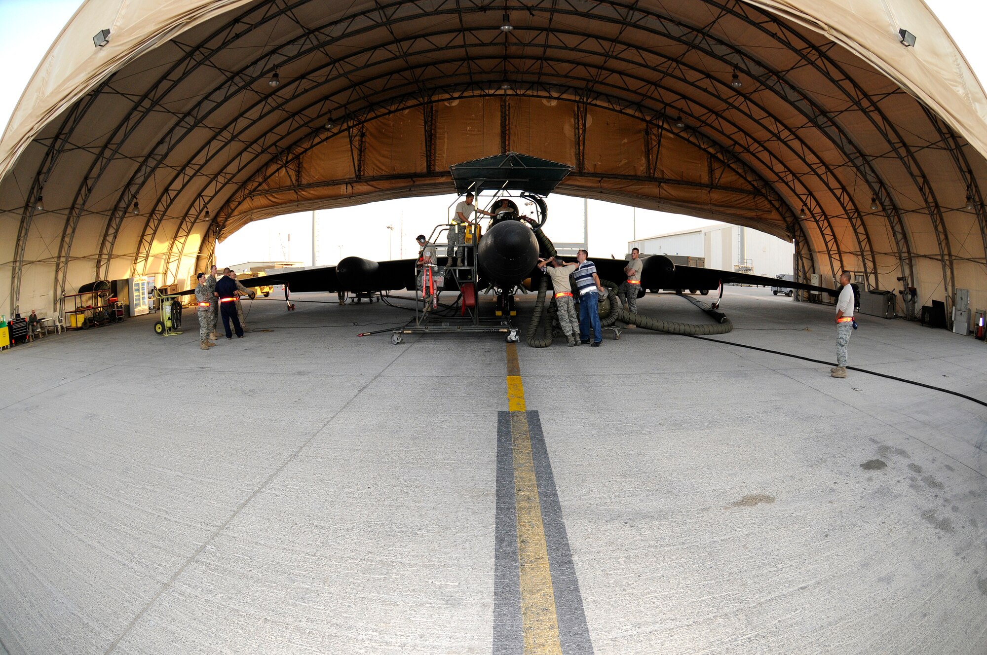 SOUTHWEST ASIA -- Members of the 99th Expeditionary Reconnaissance Squadron prepare a U-2 Dragonlady for flight here Nov. 14. The 99th ERS is responsible for gathering intelligence in the area of responsibility in support of Operation Iraqi and Enduring Freedom.  (U.S. Air Force photo/Tech. Sgt. Christopher A. Campbell)(released)