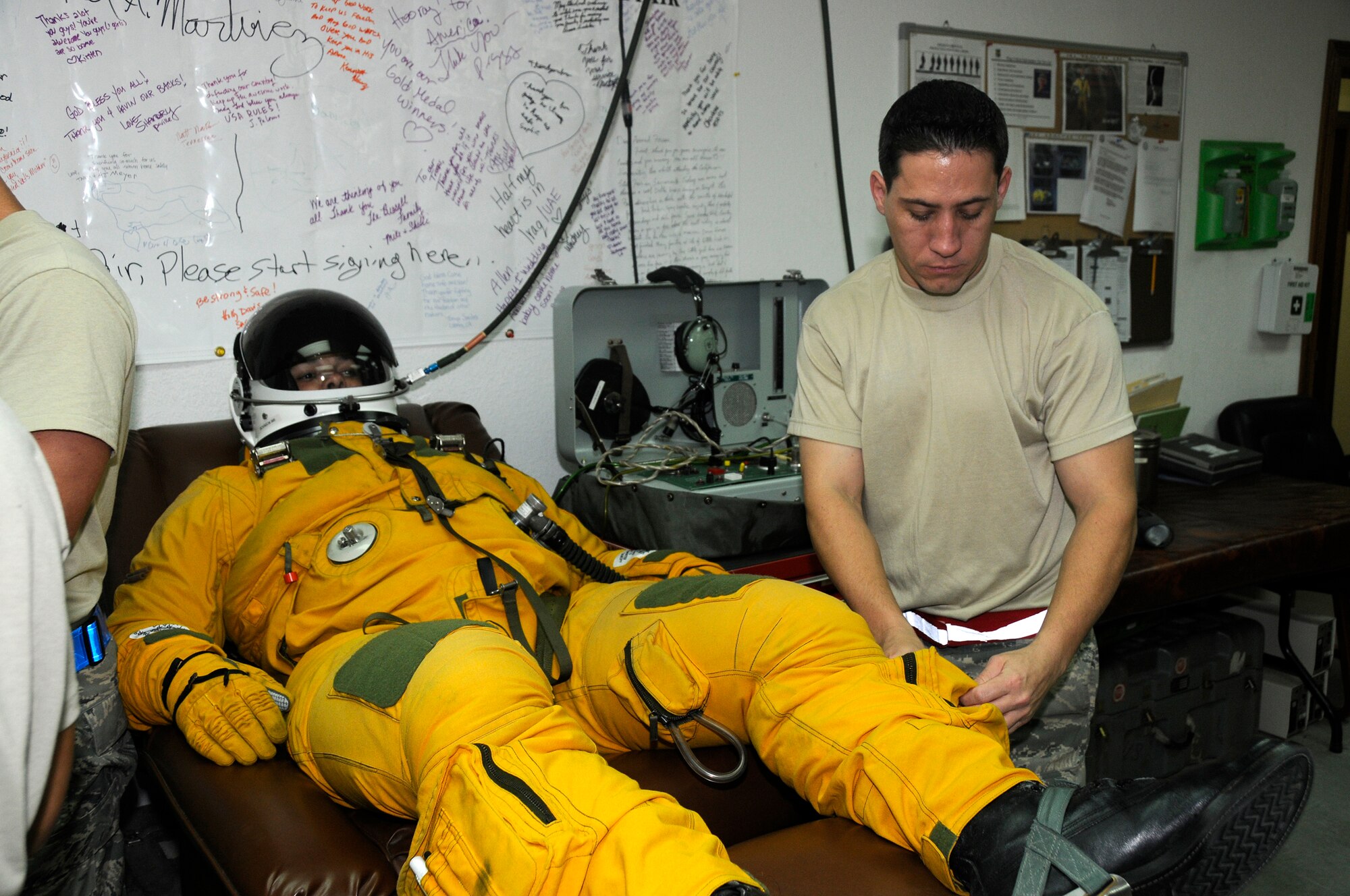 SOUTHWEST ASIA -- Lt. Col. Brian "Bubba" Dickinson receives a dose of oxygen while Tech. Sgt. Shawn Hansen performs a final inspection here Nov. 14. Sergeant Hansen is with the 99th Expeditionary Reconnaissance Squadron Physiological Support Division. Col. Dickenson is a U-2 Dragonlady pilot with the 99th ERS and is responsible for gathering intelligence in the area of responsibility in support of Operation Iraqi and Enduring Freedom.  Both are deployed from the 9th Reconnaissance Wing out of Beale Air Force Base, Calif. Sergeant Hansen is from Las Vegas, Nev. and Colonel Dickinson is a native of Oscoda, Mich., and Colorado Springs, Colo.(U.S. Air Force photo/Tech. Sgt. Christopher A. Campbell)(released)