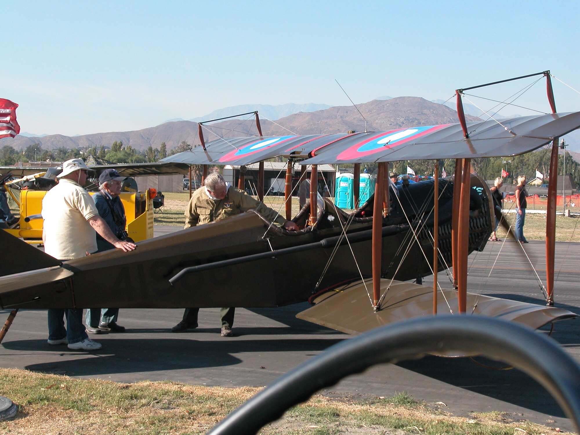 Inquisitive spectators soaked in the history and glory of the pilots who described their planes and adventures. Attendees had signed up for airplane rides or visited the chow hall, which offered the traditional fare of Spam and SOS. (U.S. Air Force photos by Maj. Don Traud)