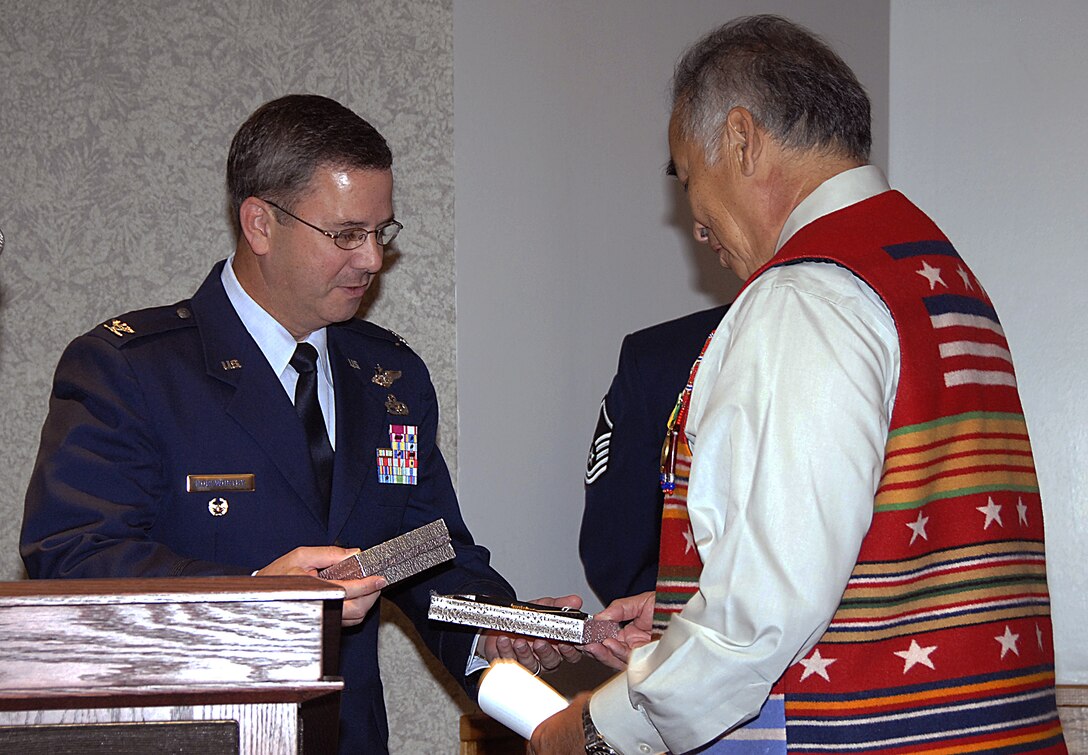 Col. David Norsworth, 82d Training Wing vice commander presents Joe Grayson, Deputy Chief of the Cherokee Tribe of Oklahoma, an Air Force Bolo Tie and an Army Bolo Tie as a "thank you" for speaking at the Native American and Alaskan Native Heritage Luncheon Nov. 13.(U.S. Air Force photo/Airman 1st Class Candy Miller)