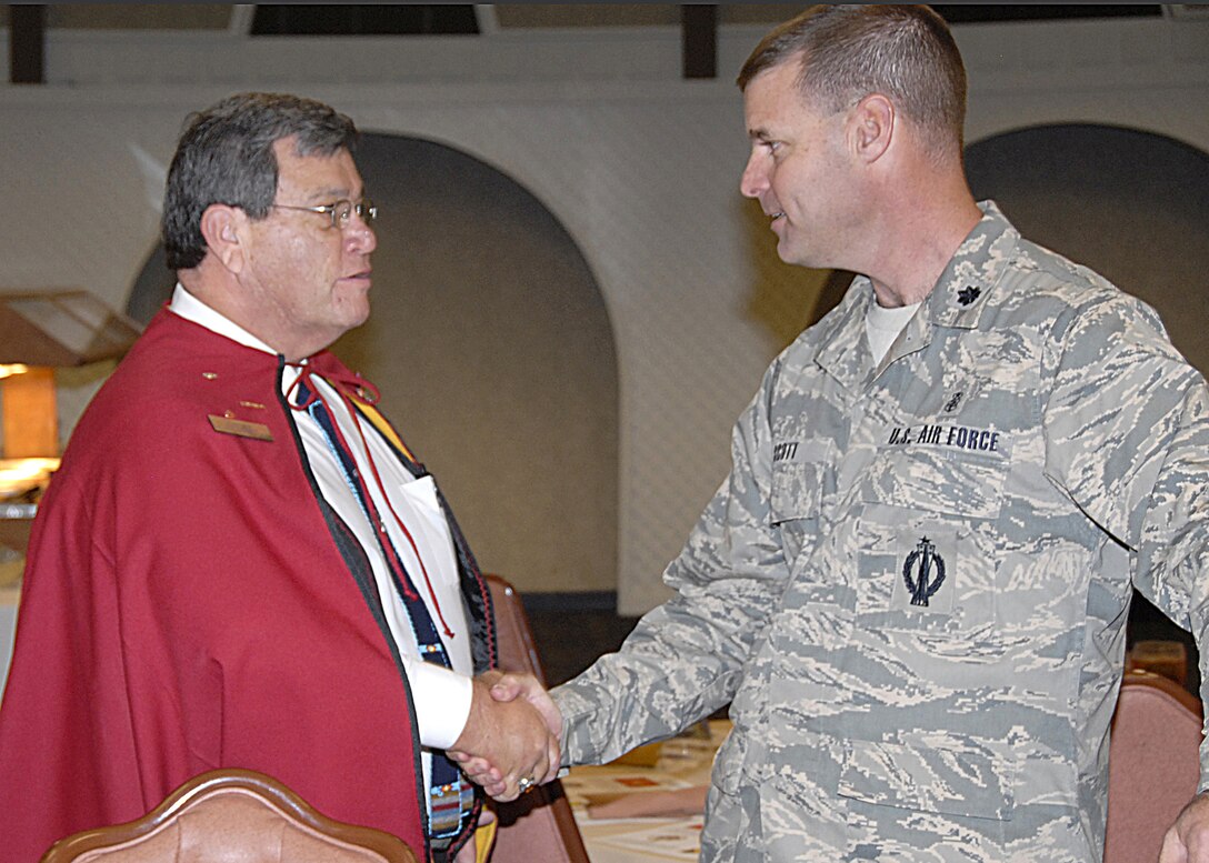 Robert Short, one of three representative of the Kiowa nation, is greeted by Lt. Col. Herbert Scott, Deputy Commander for the 882nd Training Group, prior to the Native American and Alaskan Native Heritage Luncheon Nov.13. (U.S. Air Force photo/Airman 1st Class Candy Miller)