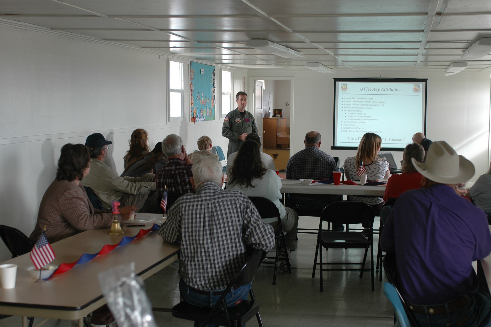 Lt. Col. Chris Martin, 388th Range Squadron assistant director of operations, speaks with approximately 30 Callao, Utah residents during the Moses Tour Nov. 6.  388th RANS leads the outreach event each fall to strengthen understanding of and support for the Air Force mission in towns underlying the UTTR. (U.S. Air Force photo)