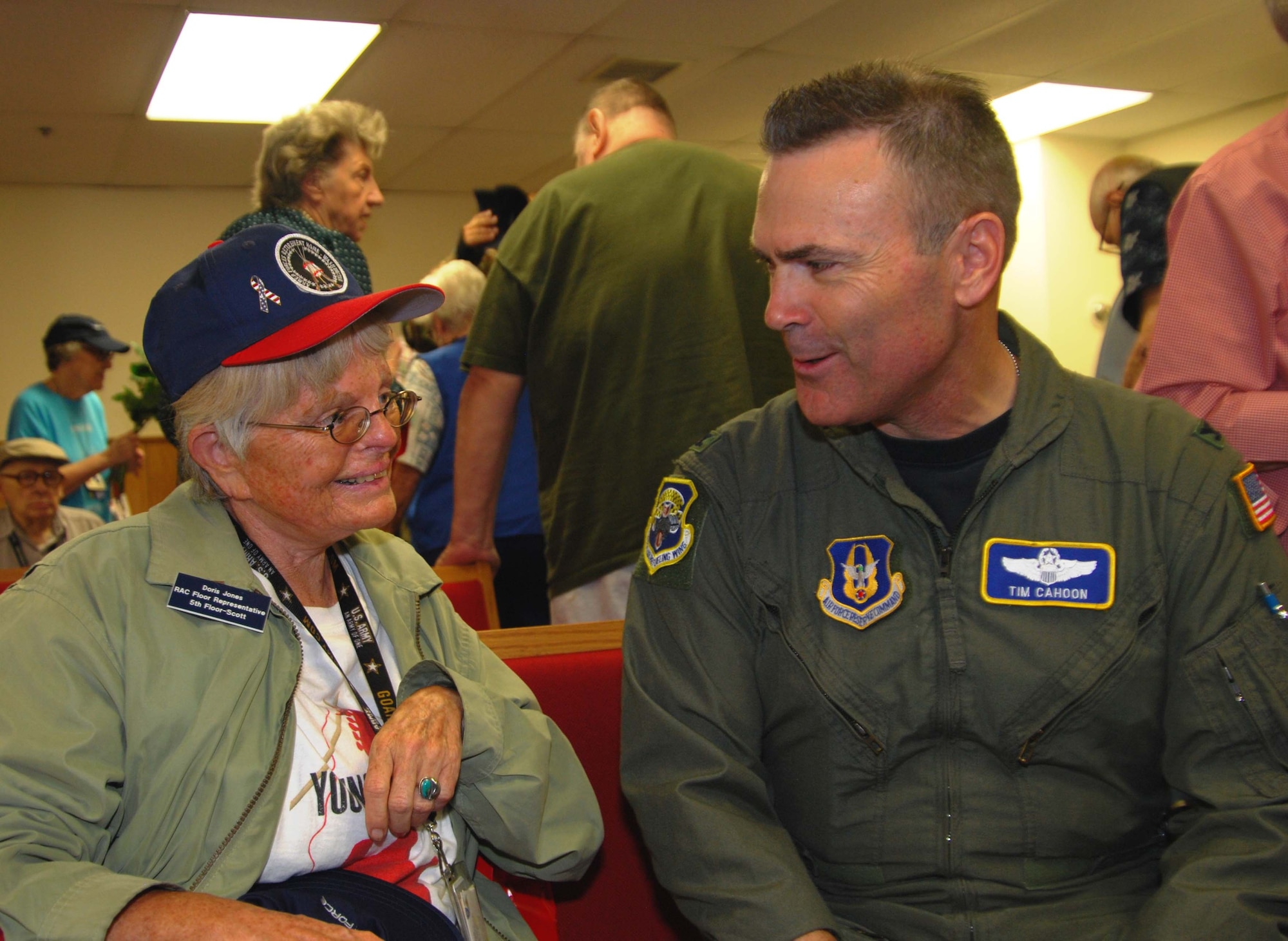 Colonel Tim Cahoon, commander of the 459th Air Refueling Wing, visits with a resident of the Armed Forces Retirement Home-Washington. Members of the 459th ARW spent the afternoon visiting the AFRH-W in honor of Veterans Day and took a tour of the campus which includes a chapel, convenience store, a 600 seat theatre, post office, library, and a 9-hole golf course.  (U.S. Air Force Photo/Senior Airman Sasha S. Skrine)



