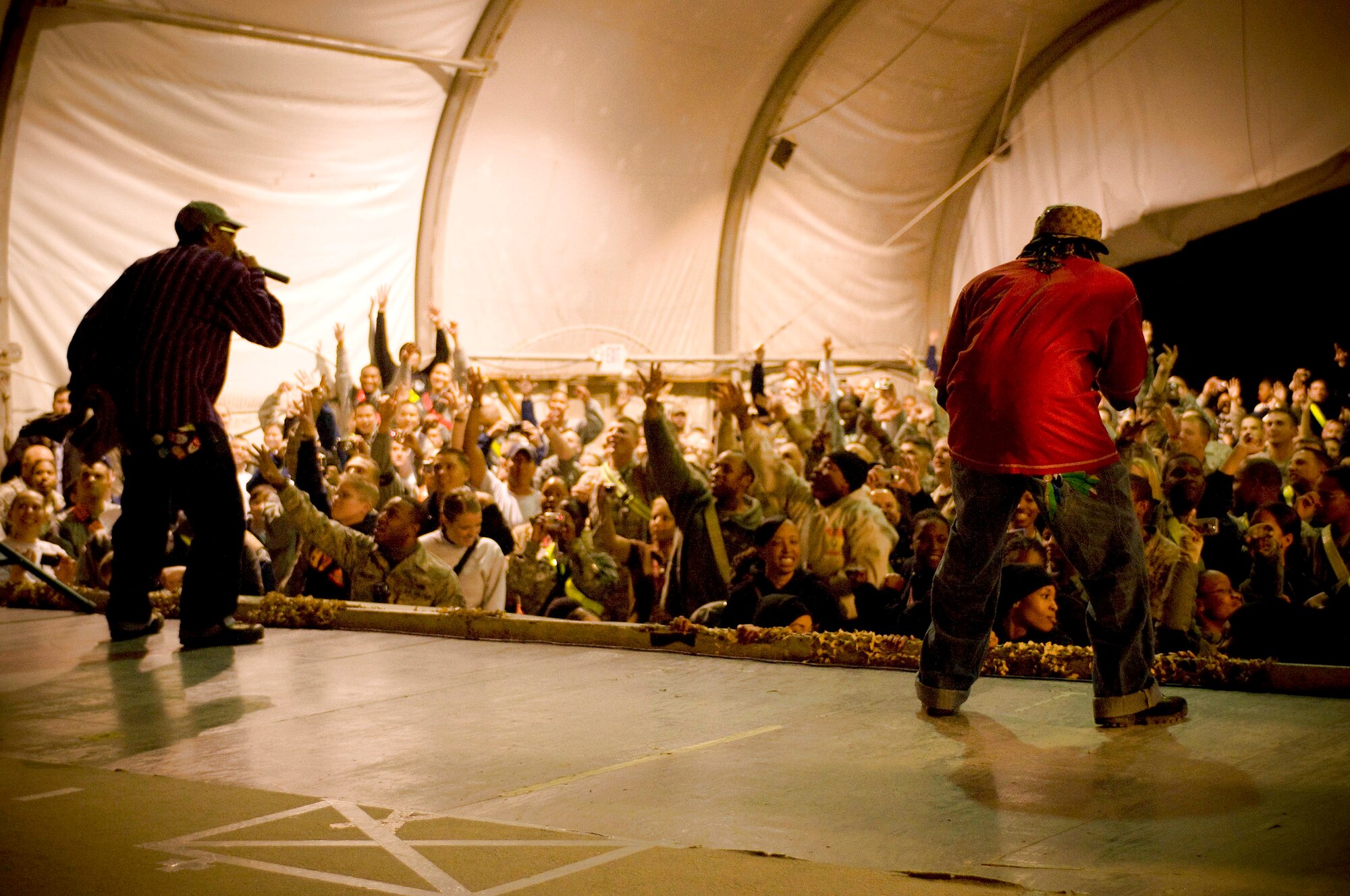 Kaine and D-Roc of the rap group Yin Yang Twins perform Nov. 13 at Bagram Airfield, Afghanistan. The Yin Yang Twins were part of the USO Tour entitled "Around the World in 8 Days. "(U.S. Air Force photo/Staff Sgt. Samuel Morse) 

