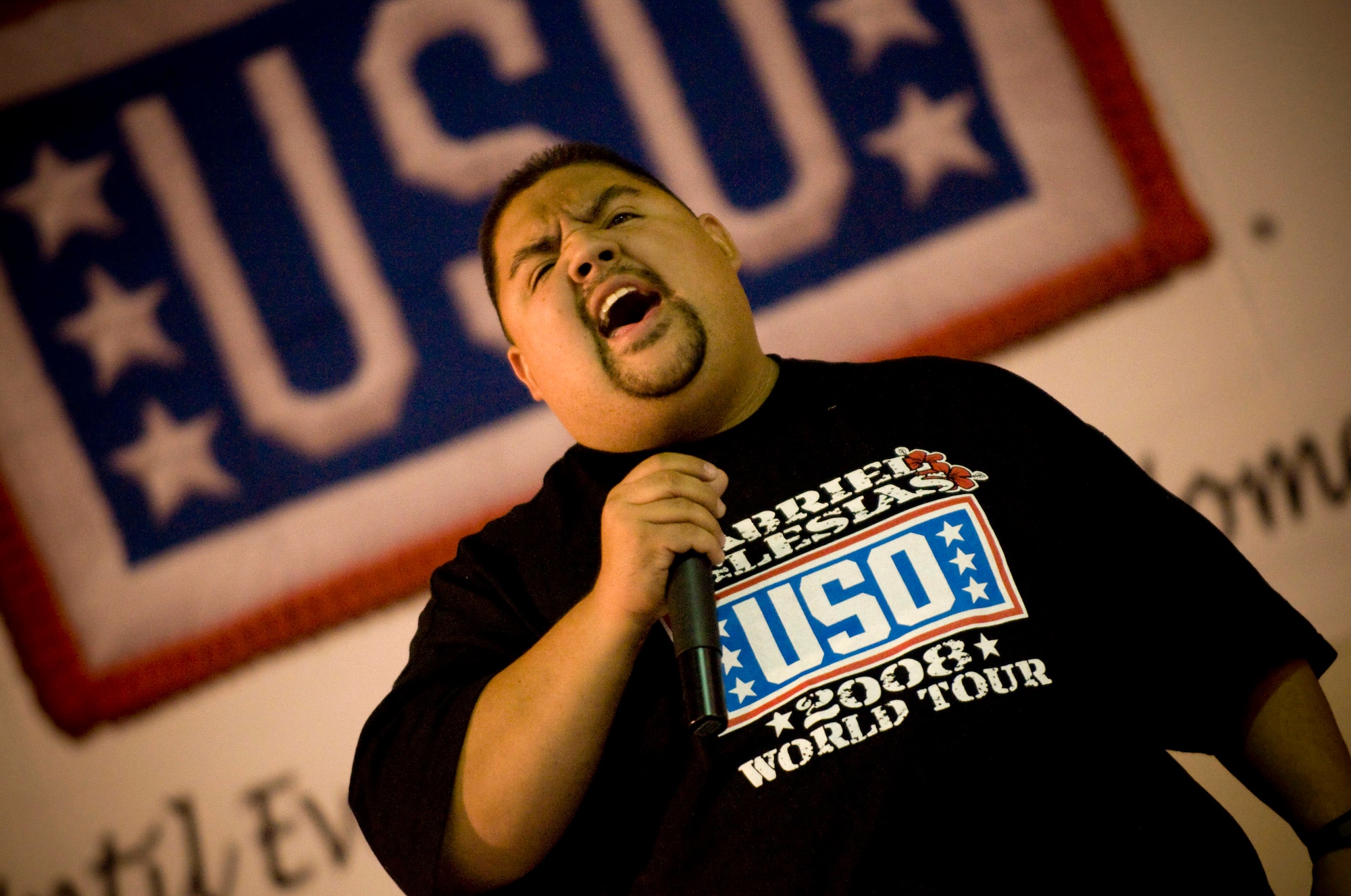 Gabriel Iglesias screams while he recounts his "combat landing" into Bagram Airfield, Afghanistan, Nov. 13. Mr. Iglesias is a comedian with the USO Tour entitled "Around the World in 8 Days." (U.S. Air Force photo/Staff Sgt. Samuel Morse)
