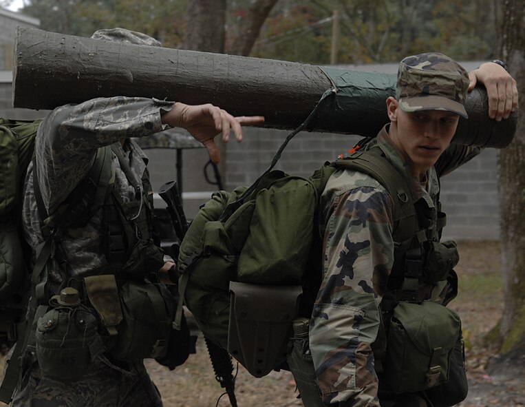 MOODY AIR FORCE BASE, Ga. --  As part of training two Airmen must carry a log with the only key to their quarters taped to the center, a measure to ensure the key would not be misplaced or lost here Nov. 13. (U.S. Air Force photo by Senior Airman Javier Cruz)