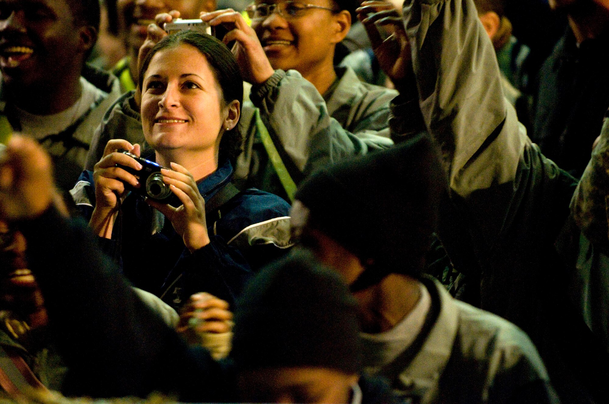 Airmen and Soldiers cheer and take photos during the USO Tour entitled "Around the World in 8 Days" Nov. 13 at Bagram Airfield, Afghanistan. (U.S. Air Force photo/Staff Sgt. Samuel Morse)

