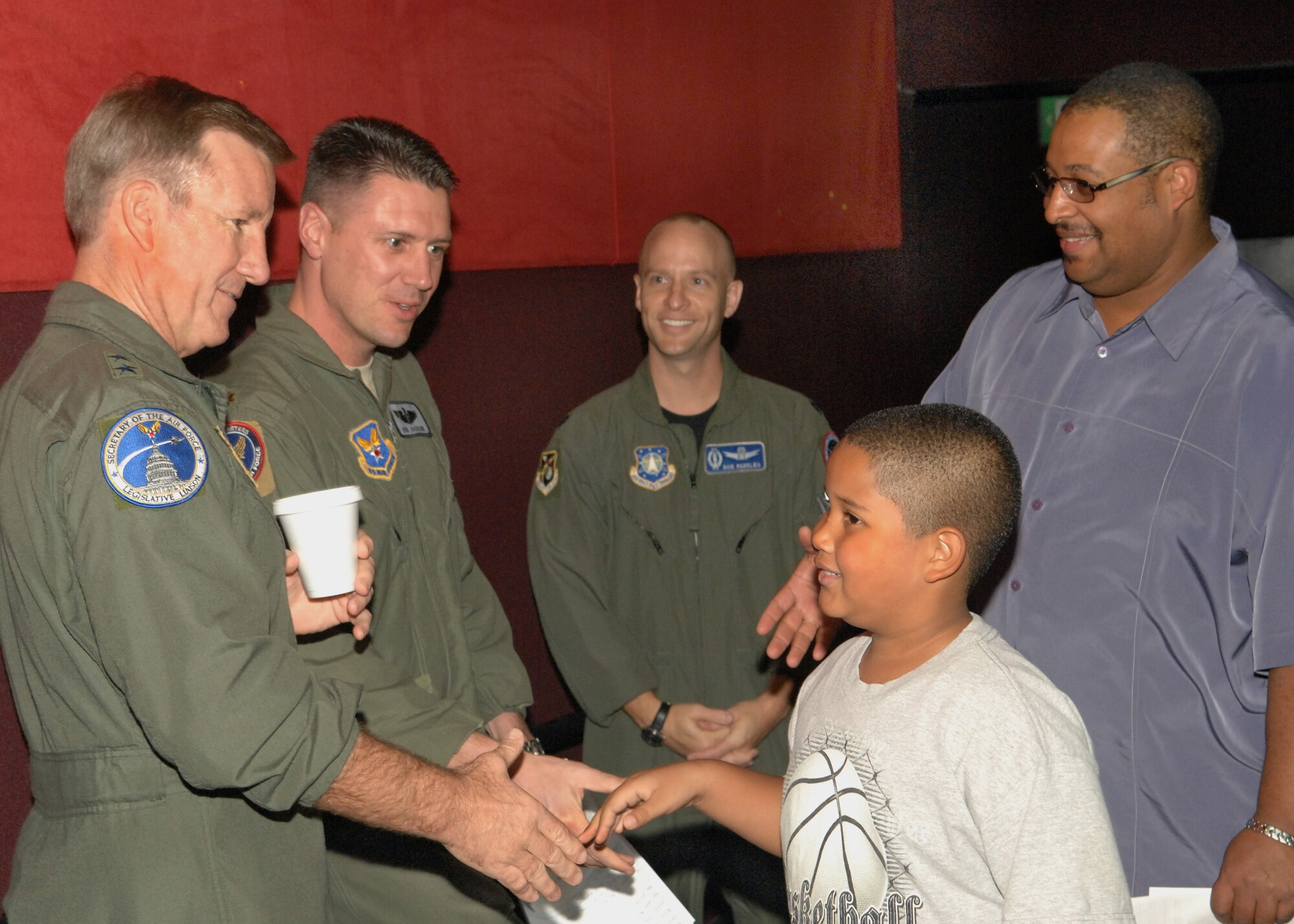 U.S. Air Force Maj. Gen. Hawk Carlisle and Maj. Rob Jackson, special guest fighter pilots, greet attendees of the Los Angeles Air Force Film Festival showing of “Fighter Pilot: Operation Red Flag,” at Canyon Country 10 Theater, Nov. 16, 2008. (U.S. Air Force photo by Senior Airman Ashley Moreno)