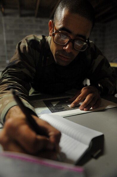 MOODY AIR FORCE BASE, Ga. -- An Airman plots coordinates for a patrol exercise during training here Nov. 14. The candidates must be proficient in 28 military skills to pass the course. (U.S. Air Force photo by Senior Airman Gina Chiaverotti)