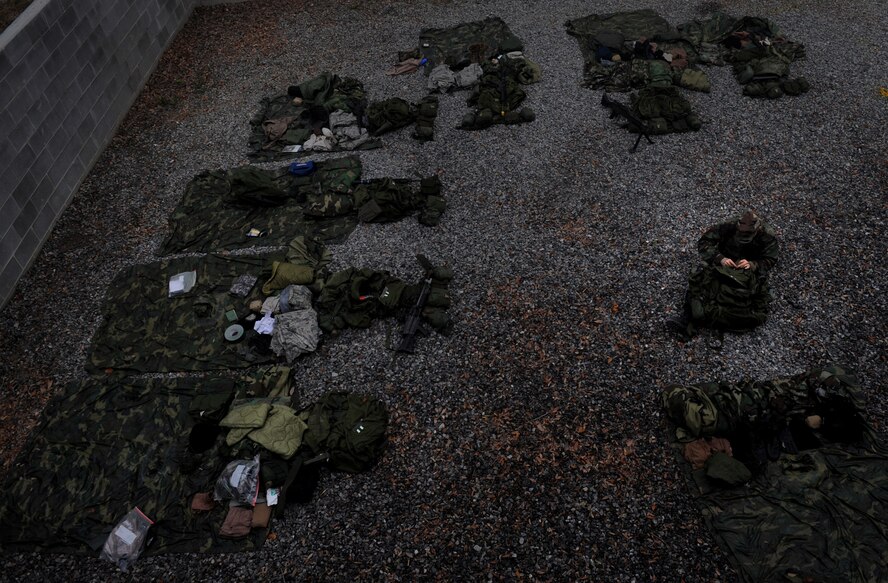 MOODY AIR FORCE BASE, Ga. -- An Airman prepares his equipment before a cadre lead patrol here Nov. 14. Candidates participated in this 13 day training to become eligible to attend Army Ranger training. (U.S. Air Force photo by Senior Airman Gina Chiaverotti)