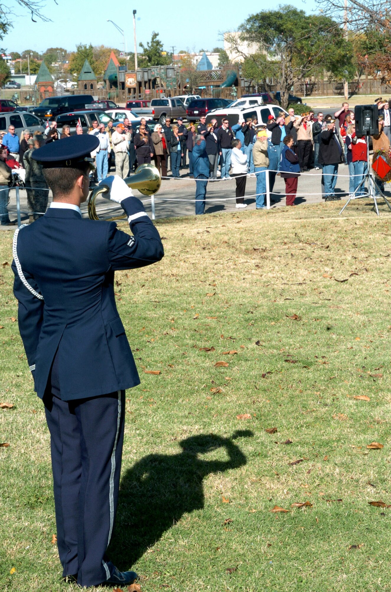 The Veteran's Day ceremony at the Jackson County War Memorial included honors to the flag supported by Airman 1st Class James Nickell’s playing of Taps. Airman Nickell is assigned to the 97th Air Mobility Wing Civil Engineer Squadron and is a member of the base honor guard. (U.S. Air Force photo/Master. Sgt. Paul Dean)
