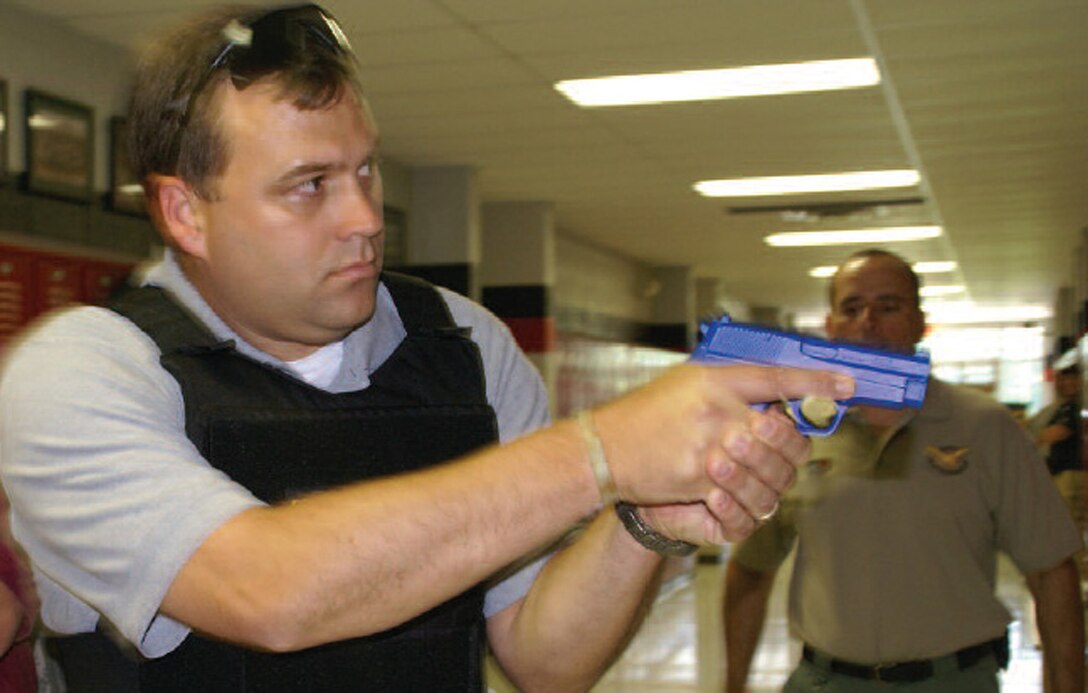 SA Robert Redmon receives instruction from a National Tactical Officer’s Association member during his active shooter training. (U.S. Air Force photo)