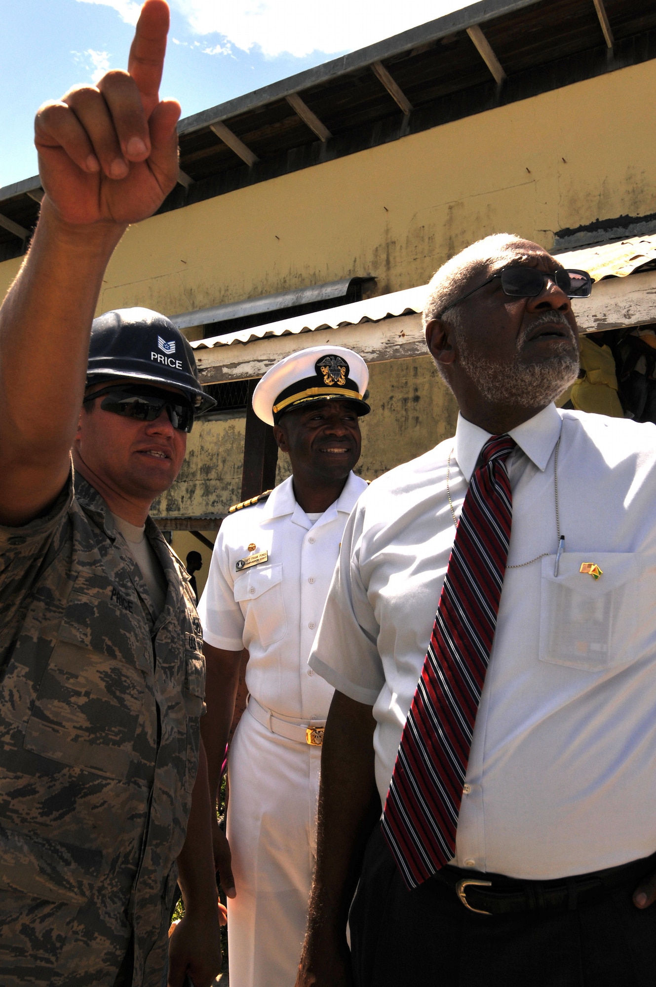 GEORGETOWN, Guyana -- Tech. Sgt. Derron Price, 5th Civil Engineer Squadron project site leader, embarked aboard USS Kearsarge (LHD 3), talks to Capt. Fernandez "Frank" Ponds, mission commander, Continuing Promise 2008, and U.S. Ambassador John Jones during tours of the various engineering project sites. Approximately 40 Airmen from 5th CES are supporting CP 2008, a four-month mission in the U.S. Southern Command area of responsibility. (U.S. Navy photo by Mass Communication Specialist 3rd Class (SW) David Danals)