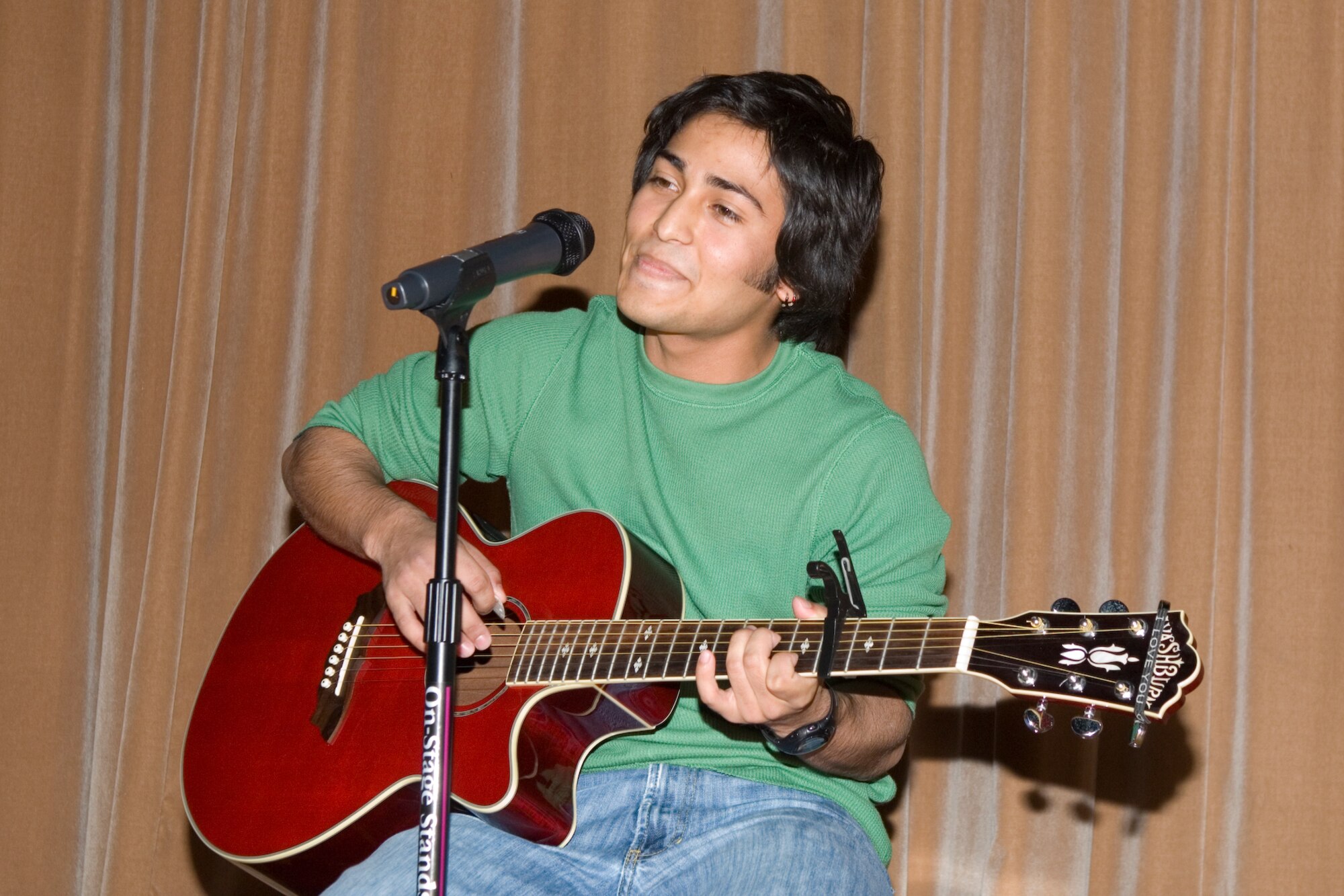 HANSCOM AIR FORCE BASE, Mass. – Ryan Ruiz demonstrates his acoustical skills during the 66th Services Squadron’s talent contest at the Base Theater on Nov. 13. Ryan went on to capture first place in the teen category, other first place winners included: Colin Canavan; Sidney Pandes; Adrienne Austin and Whitney Evans; and Tamala, Ytrenda and Brenda Gulley in the parent and youth team category. (U.S. Air Force photo by Rick Berry)