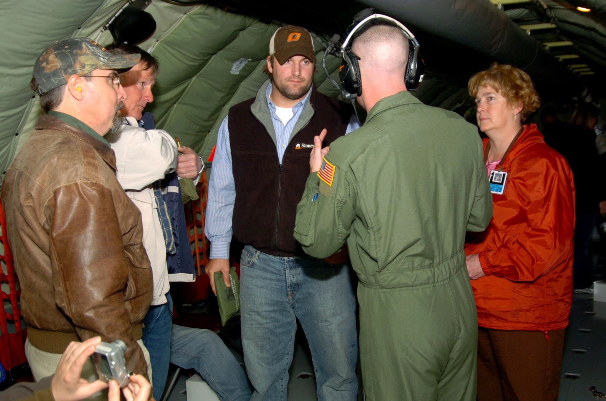 When aircrew aboard a KC-135 Nov. 14 told guests of the Altus-Altus Air Force Base Farm-City outreach program that it was safe to move about the cabin, boom operator Staff Sgt. Doug Boren became an immediate focus of attention. The Sergeant professionally answered questions about everything Air Force, proclaiming the event a great opportunity to showcase the Air Force and Altus AFB. (U.S. Air Force photo/ Master Sgt. Paul Dean)