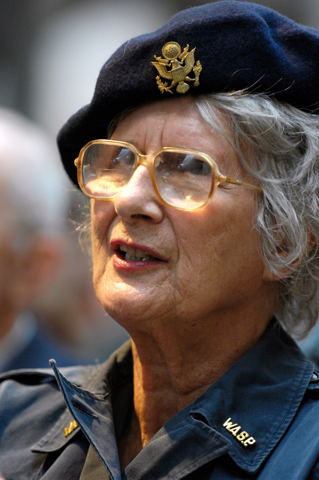 Joan Lemley, a World War II Women Airforce Service Pilot, listens to a speaker while attending the "Fly Girls of World War II" exhibit which opened in their honor Nov. 14 at the Women in Military Service for America Memorial in Arlington, Va.  Approximately 25 WASPs attended the opening ceremony.  WASPs were the first U.S. military-trained women aviators in history.  (U.S. Air Force photo/Scott M. Ash)