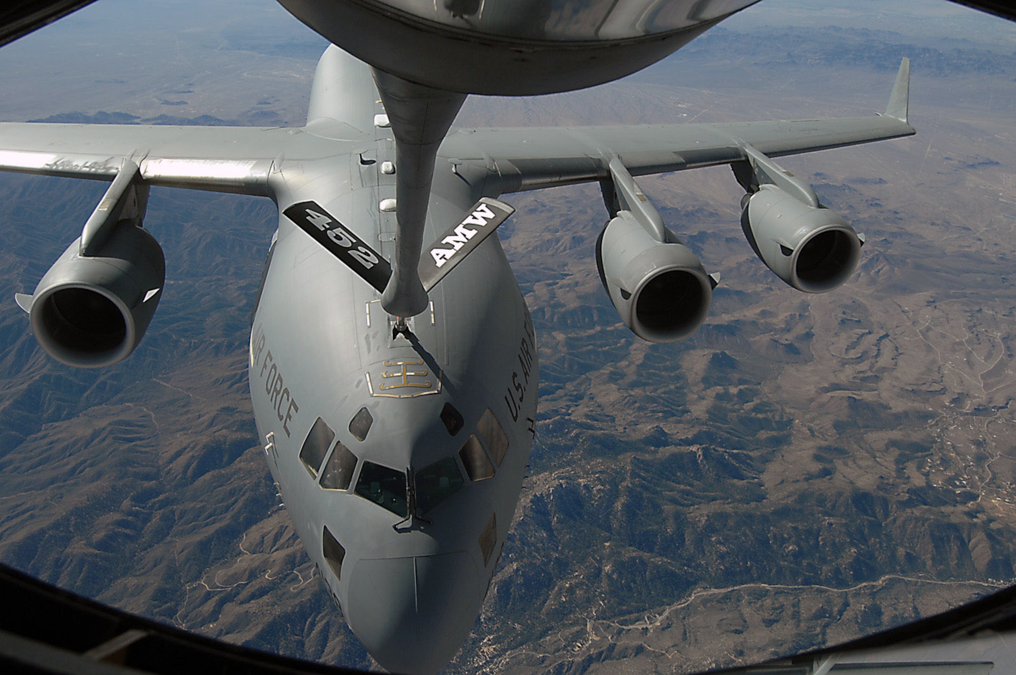 C-17 Globemaster III receives fuel from a KC-135 Stratotanker during an aerial refueling mission Nov. 12 over the Southwest. Both aircraft are from the 452nd Air Mobility Wing at March Air Reserve Base, Calif. (U.S. Air Force photo/Master Sgt. Rick Sforza) 