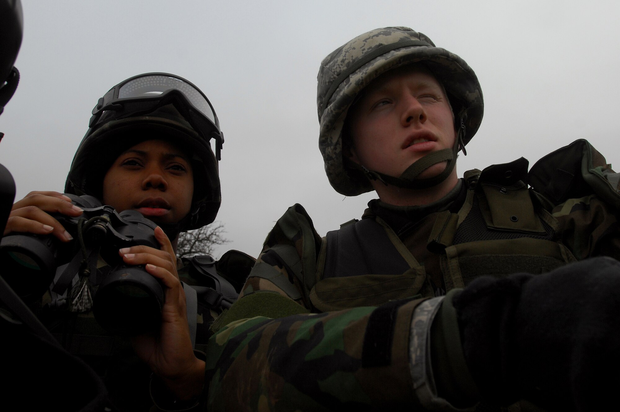 Airman 1st Class Yazmine Nash, 423rd Security Forces Squadron, Royal Air Force Alconbury, receives instruction from her wingman while performing range estimation during a Mounted Operations exercise, Nov. 15, 2008, Baumholder, Germany. During this two-day exercise, students were taught convoy and patrol techniques.  (U.S. Air Force photo Airman 1st Class Kenny Holston)