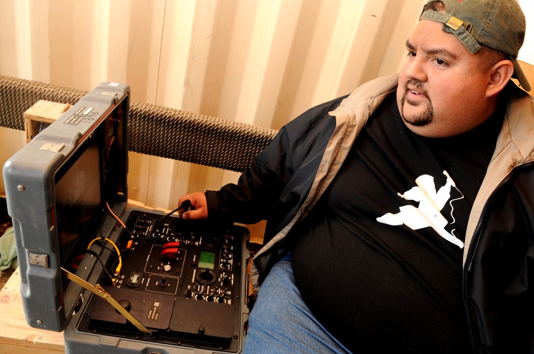 Comedian Gabriel Iglesias operates controls for a bomb disposal robot during a visit to Bagram Air Base, Afghanistan, Nov. 14, 2008. Iglesias is part of a USO group accompanying Vice Chairman of the Joint Chiefs of Staff U.S. Marine Gen. James E. Cartwright on an eight-day tour with the USO. 