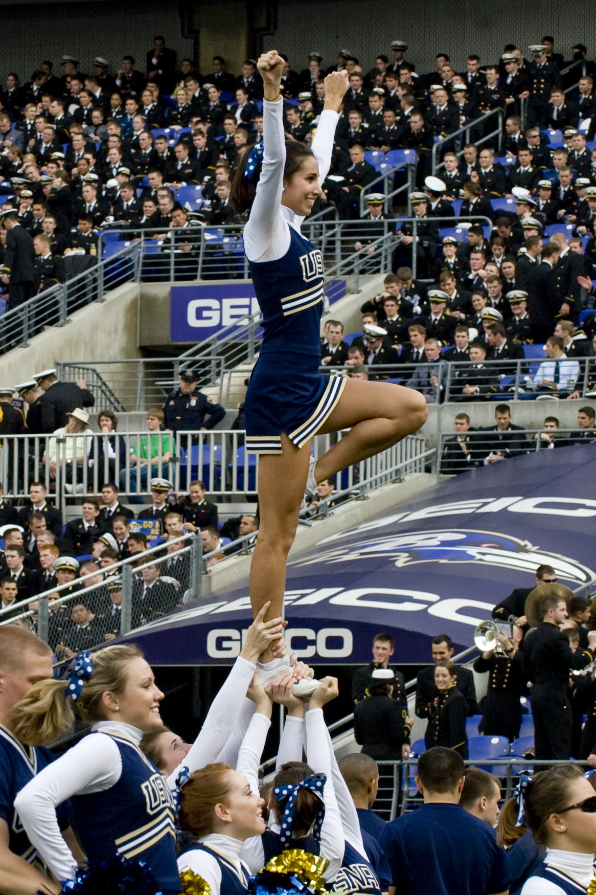 Navy cheerleaders try to get the crowd involved during the Navy vs