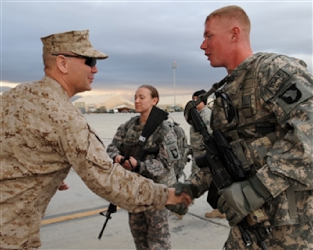 Vice Chairman of the Joint Chiefs of Staff Marine Gen. James E. Cartwright (left) thanks a U.S. soldier for providing protection during his visit to Forward Operating Base Fenty, Afghanistan, on Nov. 13, 2008.  Cartwright is visiting the base to receive updates on operations and bring USO performers to entertain the troops.  