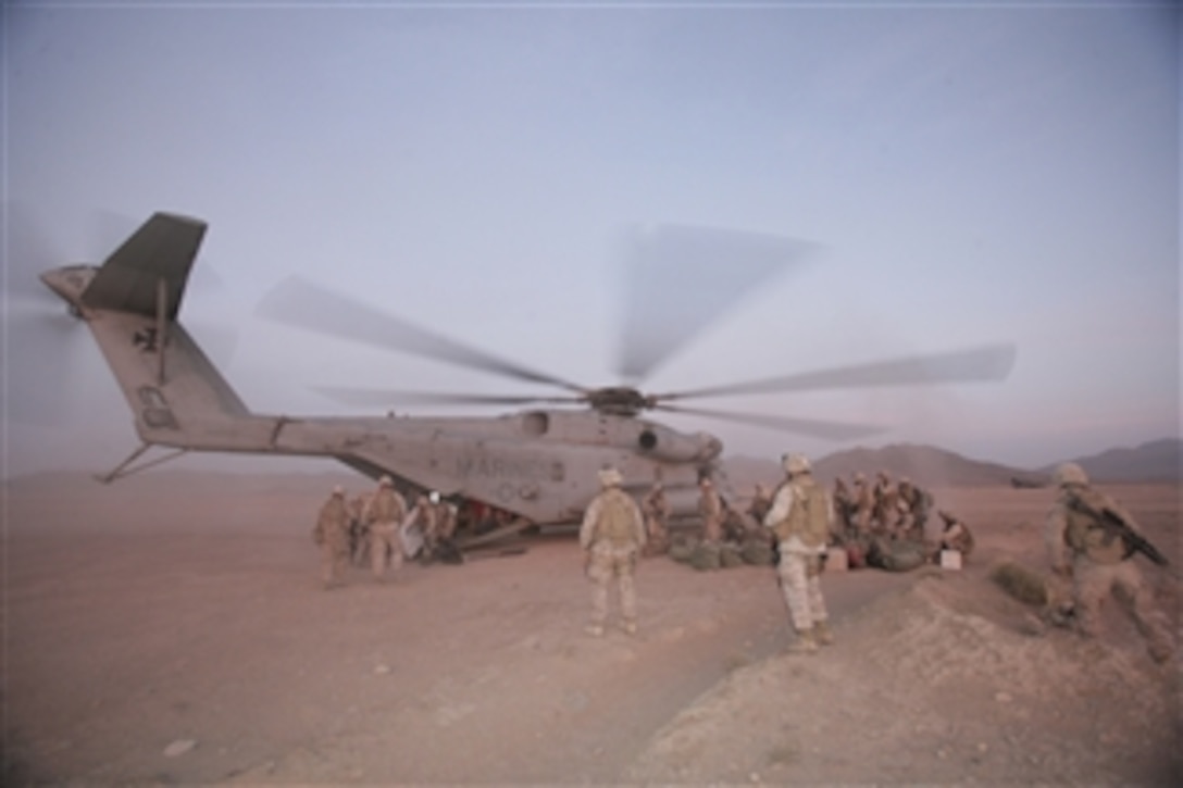 U.S. Marines with 2nd Battalion, 7th Marine Regiment unload a CH-53E Super Stallion helicopter in Now Zad, Afghanistan, on Nov. 10, 2008.  The Marines are assigned to a reinforced light infantry battalion.  