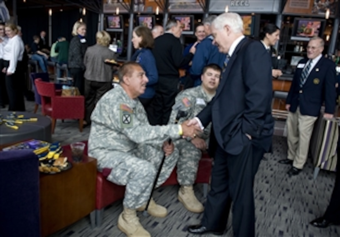 Defense Secretary Robert M. Gates meets with wounded warriors prior to the start of the Navy vs. Notre Dame football game in Baltimore, Nov. 15, 2008. Notre Dame won, 27-21.