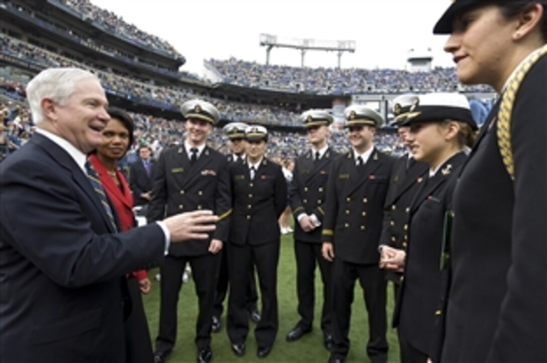 Defense Secretary Robert M. Gates and Secretary of State Condoleezza Rice speak with U.S. Navy midshipmen prior to the start of the Navy vs. Notre Dame football game in Baltimore, Nov. 15, 2008. The Fighting Irish defeated the midshipmen, 27-21.