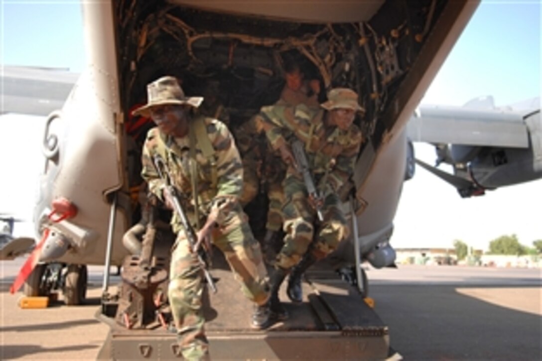 Senegalese soldiers practice exiting the ramp of a U.S. Air Force CV-22 in Bamako, Mali on Nov. 12, 2008. The soldiers are participating in Operation Flintlock on Nov. 16, 2008. Operation Flintlock is a multilateral military exercise to further the training and proficiencies of participating nations across the Trans-Saharan region while fostering collaborative communication and coordination skills. 