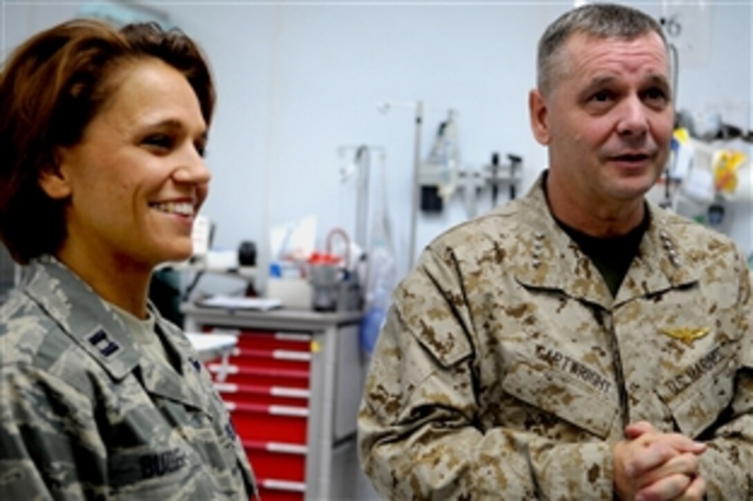 Vice Chairman of the Joint Chiefs of Staff U.S. Marine Gen. James E. Cartwright asks U.S. Air Force Capt. Melissa Buzbee a question about medical equipment during a visit to Bagram Air Base, Afghanistan, Nov. 14, 2008. Cartwright toured the facility to check on health care for wounded servicemembers. 
