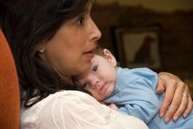Dana Katz holds Hunter Mankin at her home in Los Angeles Nov. 17. Todd and Dana Katz hosted the Mankins for dinner during their trip to Los Angeles for Aaron's 12th surgery at UCLA. Todd, Dana and their children are Operation Mend's premier buddy family, providing friendship and support to Mankin, his wife Diana and their children during Mankin's 12 trips to UCLA. Dana oversees and coordinates the buddy family program.