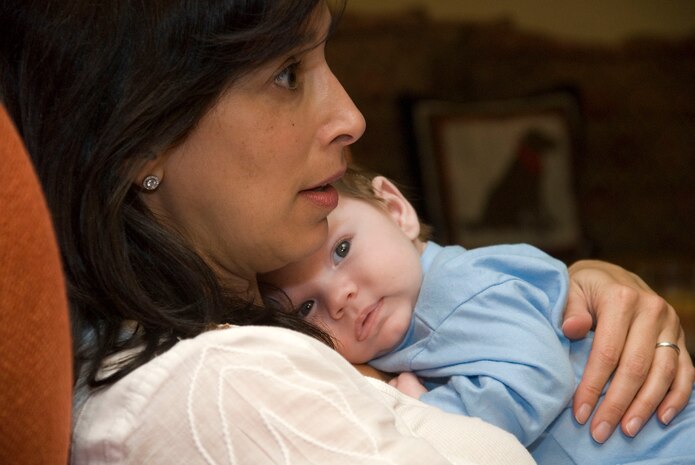 Dana Katz holds Hunter Mankin at her home in Los Angeles Nov. 17. Todd and Dana Katz hosted the Mankins for dinner during their trip to Los Angeles for Aaron's 12th surgery at UCLA. Todd, Dana and their children are Operation Mend's premier buddy family, providing friendship and support to Mankin, his wife Diana and their children during Mankin's 12 trips to UCLA. Dana oversees and coordinates the buddy family program.