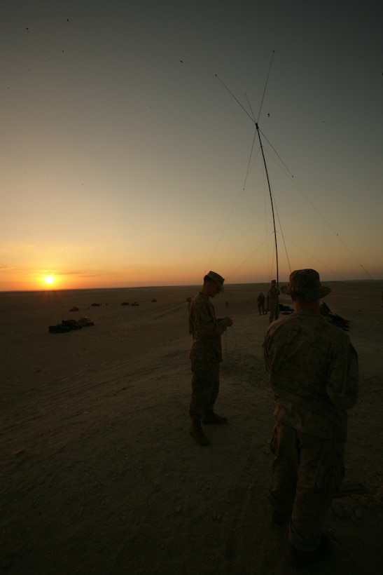 In preparation for the day's training, Marines from the 26th Marine Expeditionary Unit's Battalion Landing Team 2/6's Golf Company raise a radio antenna. More than 90 Marines and sailors participated in bilateral infantry training with a Middle Eastern nation, from Nov. 18-24. The 26th MEU is currently forward deployed aboard the Iwo Jima Expeditionary Strike Group in the Arabian Gulf in support of Maritime Security Operations. (Official Marine Corps Photo by Cpl. Jason D. Mills) (Released)