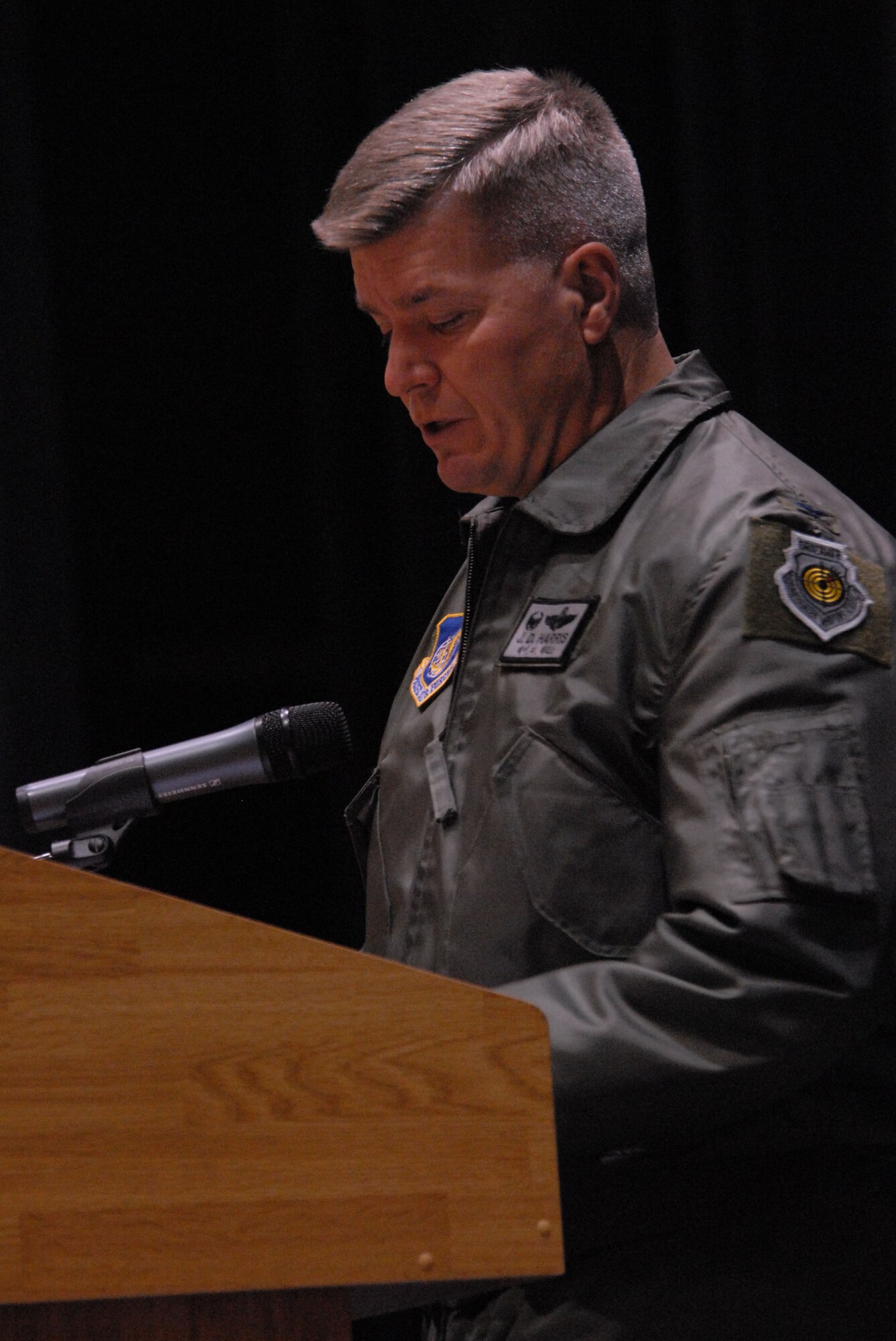 Colonel J.D. "Wolf" Harris, 8th Fighter Wing commander, addresses Airmen during his first commander's call at Kunsan Air Base, Republic of Korea, Nov. 18, 2008. He spoke to Airmen about leadership changes at the wing, expectations, and Pacific Air Force Commander Gen. Howie Chandler's, priorities of compliance, attention to detail, mission focus, leadership and accountability. (U.S. Air Force photo/Senior Airman Gustavo Gonzalez) 