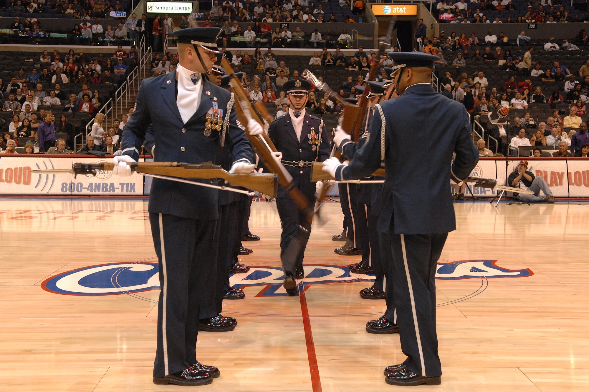 The U.S. Air Force Honor Guard Drill Team demonstrates precision rifle maneuvers at the Staples Center in Los Angeles before the Clippers vs. Spurs basketball game during Air Force Week, Nov. 17, 2008.  (U.S. Air Force photo by Senior Airman Matthew Smith)