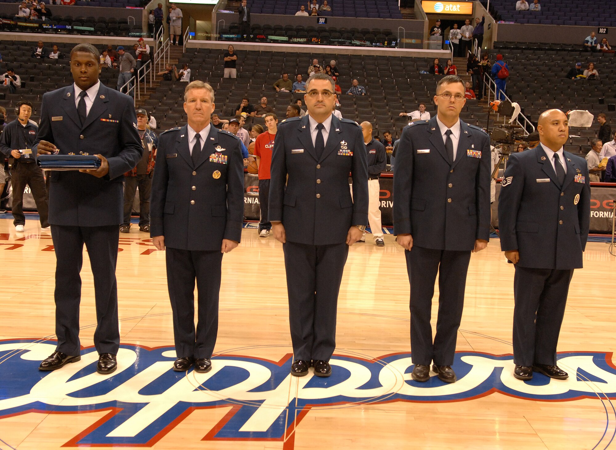 U.S. Air Force medal recipients stand center court at the Staples Center in Los Angeles Calif., before the LA Clippers take on the San Antonio Spurs, Nov. 17.  The Airmen were awarded their medals at the game in recognition of Air Force Week. (U.S. Air Force photo by Senior Airman Matthew Smith)