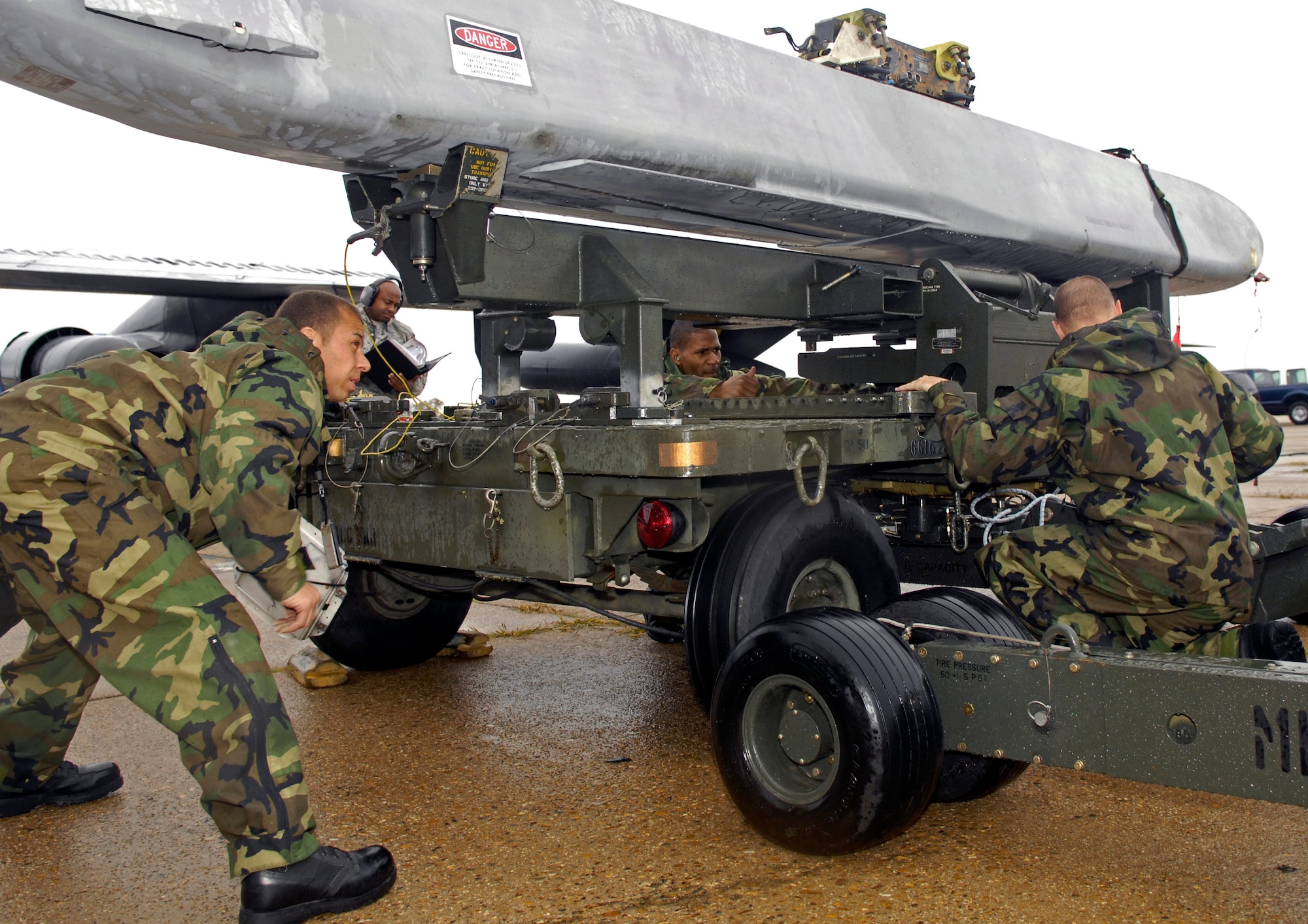 BARKSDALE AIR FORCE BASE, La. -- A 2d Maintenance Squadron weapons load team is evaluated during a portion of the Air Combat Command Nuclear Surety Inspection here Nov.12.  Base officials welcomed members of the ACC Inspector General team Nov. 9 to focus on three major graded areas throughout the inspection: Nuclear surety program management and administration, the personnel reliability program and logistics movement. (Air Force photo by Senior Airman Alexandra Sandoval) 