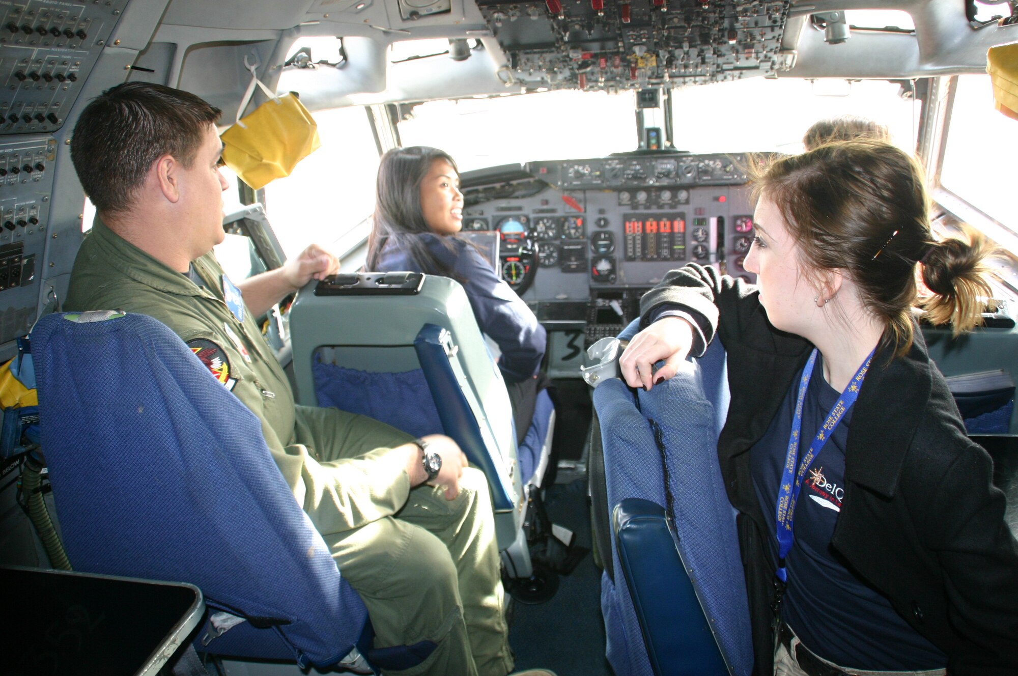 SSgt Jason Peters, flight engineer, 966th Airborne Air Control Squadron, fulfills the students’ curiosities by explaining what several buttons and levers do in the cockpit of the E-3 Sentry. Photo compliments of 1Lt Kinder Blacke.