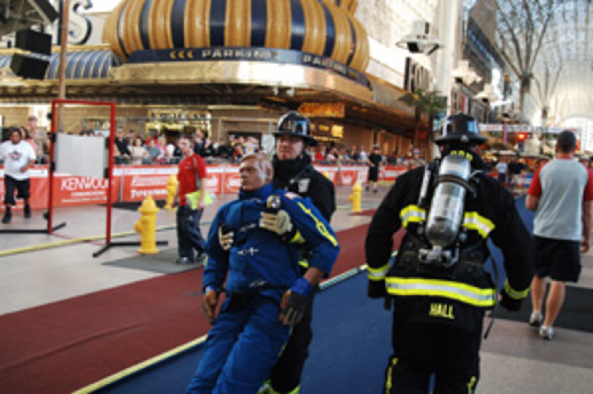 Members of Peterson Air Force Base’s fire department compete at the World Championship Firefighter Combat Challenge Nov. 13. The firefighter challenge course requires team members to run through a variety of firefighting-related tests, including climbing a five-story tower while carrying a 45-pound pack, simulating a forced entry and rescuing a 175-pound "victim." Teams usually must complete the course in less than two minutes to remain competitive. Members of the Peterson Firefighter Challenge team include Staff Sgts. Jimmy Welch, Joel Hammond, Nick Hall and Ryan Taylor and Senior Airmen John Dannen and Chris Ingle.
