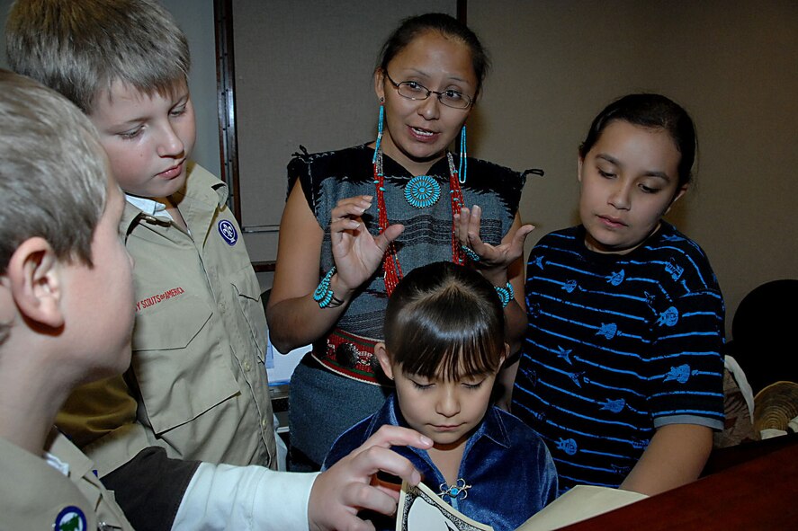 OFFUTT AIR FORCE BASE, Neb. -- Local boy scouts listen to Native American story telling at the library here Nov 15. Dia Molnar, a Navajo woman, answered questions for the boy scoouts and other attendees about the Navajo alphabet.  (U.S. Air Force Photo By Kendra Williams)