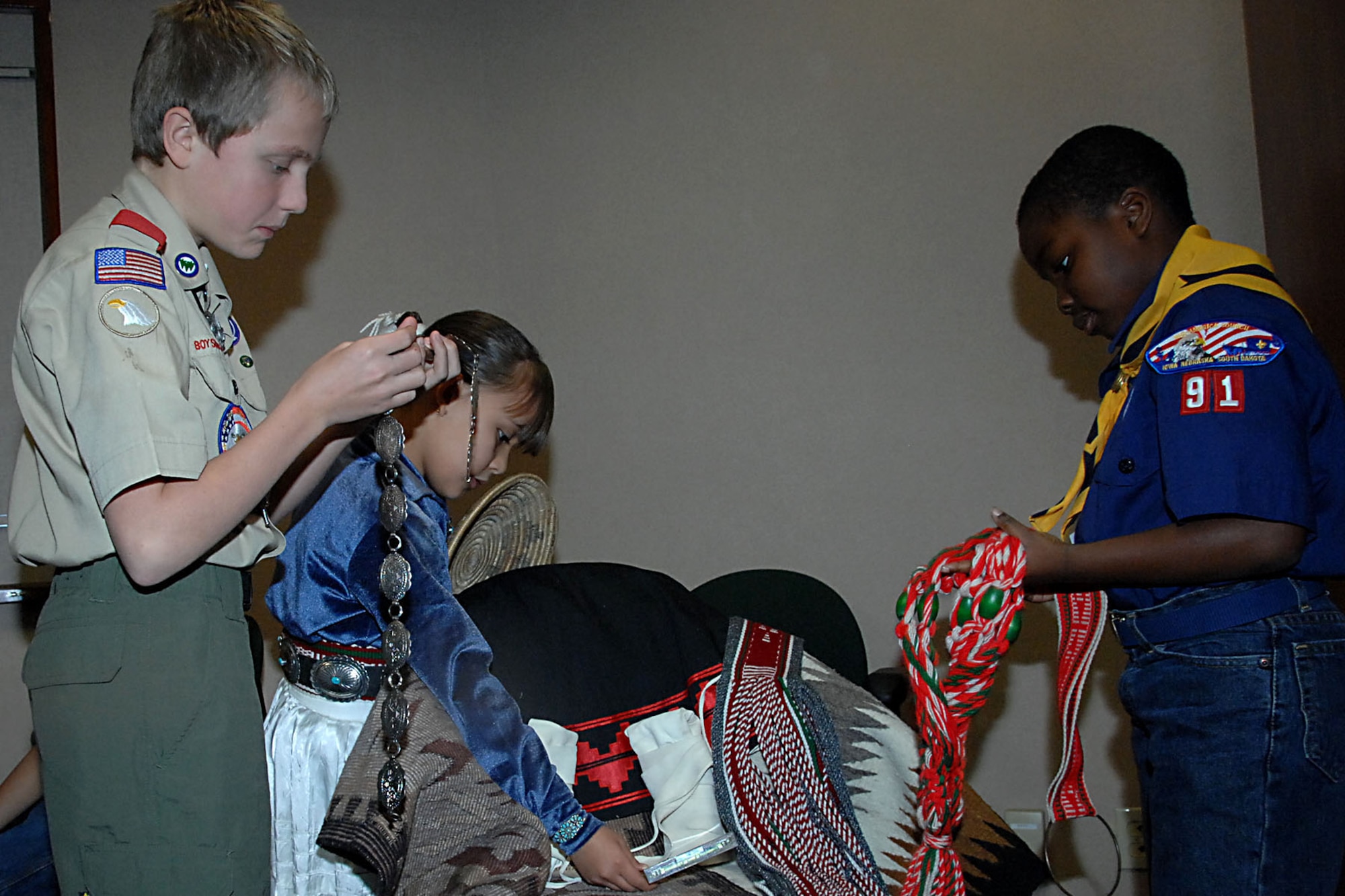 OFFUTT AIR FORCE BASE, Neb. --  Kyle Hefner, a member of Boy Scout Troop 305, and son of Ron Hefner, a civilian with U.S. Strategic Command, and Henry Larweh, a cub scout in Pack 91, son of Maxwell and Patience Larweh, look at some Navajo made items at a Native American story telling event at the library here Nov. 15.  Briana Rehm, who is half Navajo, assisted the boy scouts in their understanding of the Navajo culture both past and present.  (U.S. Air Force Photo By Kendra Williams)